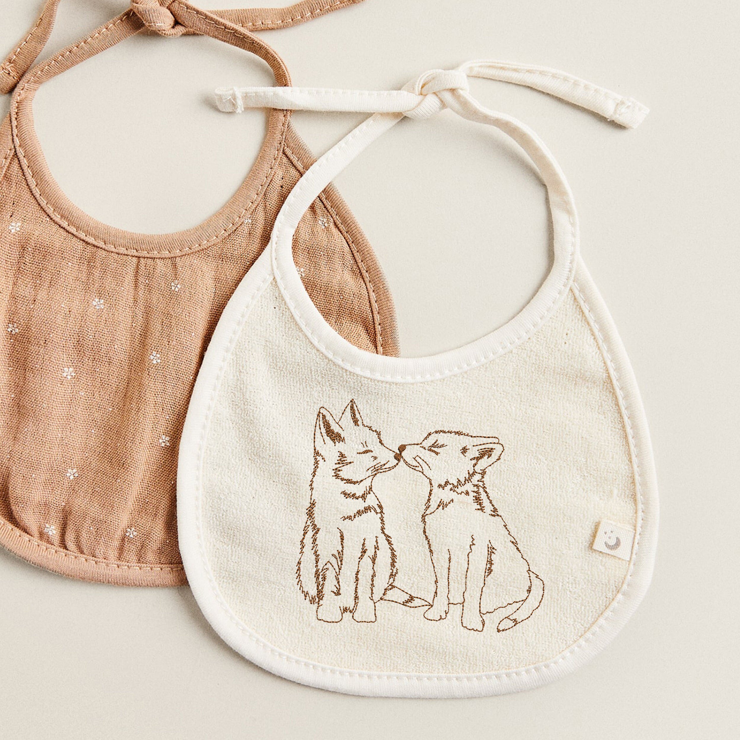 Adorable Foxes Machine Embroidery Design embroidered on a bib