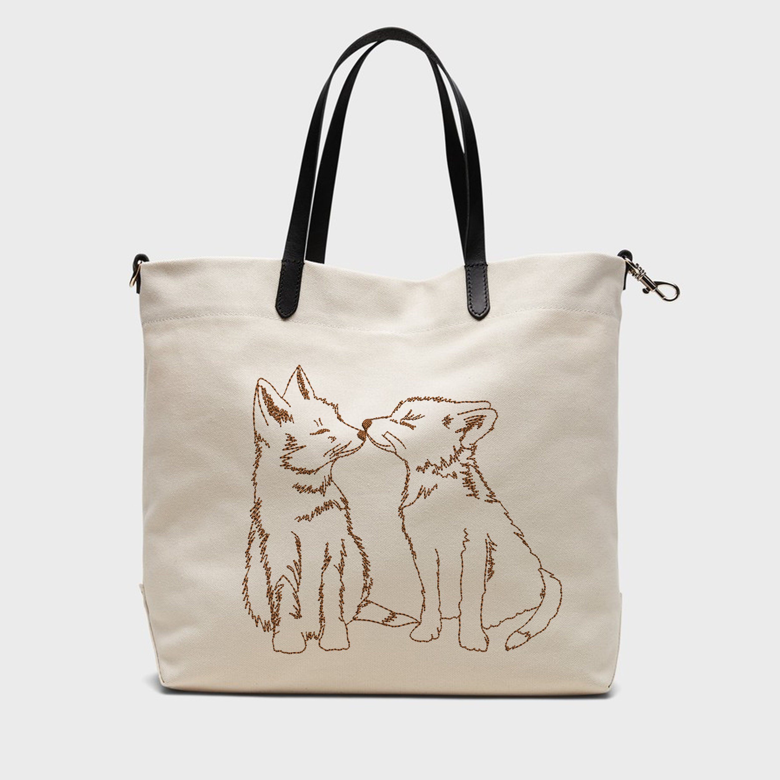 Adorable Foxes Machine Embroidery Design embroidered on a handbag