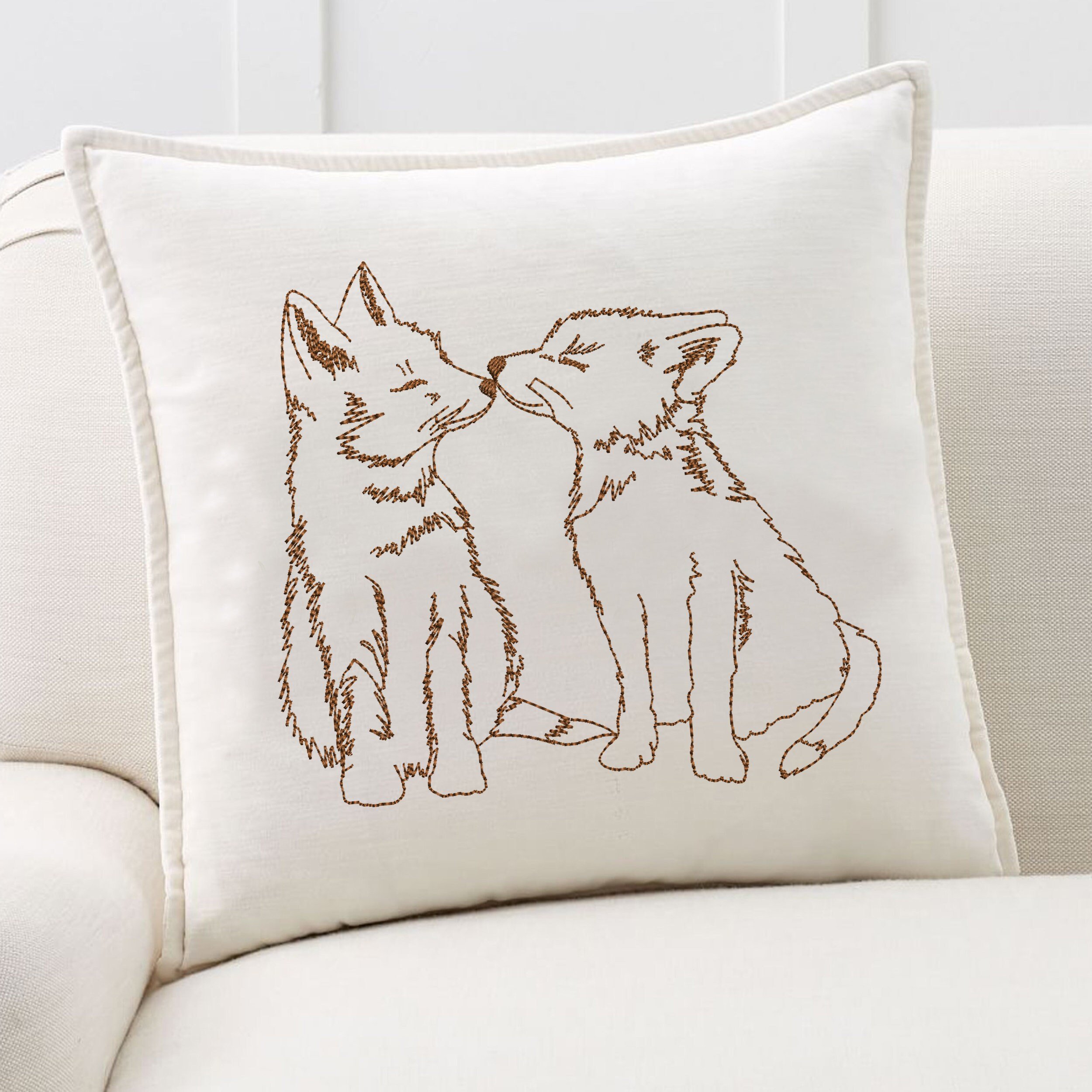 Adorable Foxes Machine Embroidery Design embroidered on a pillow