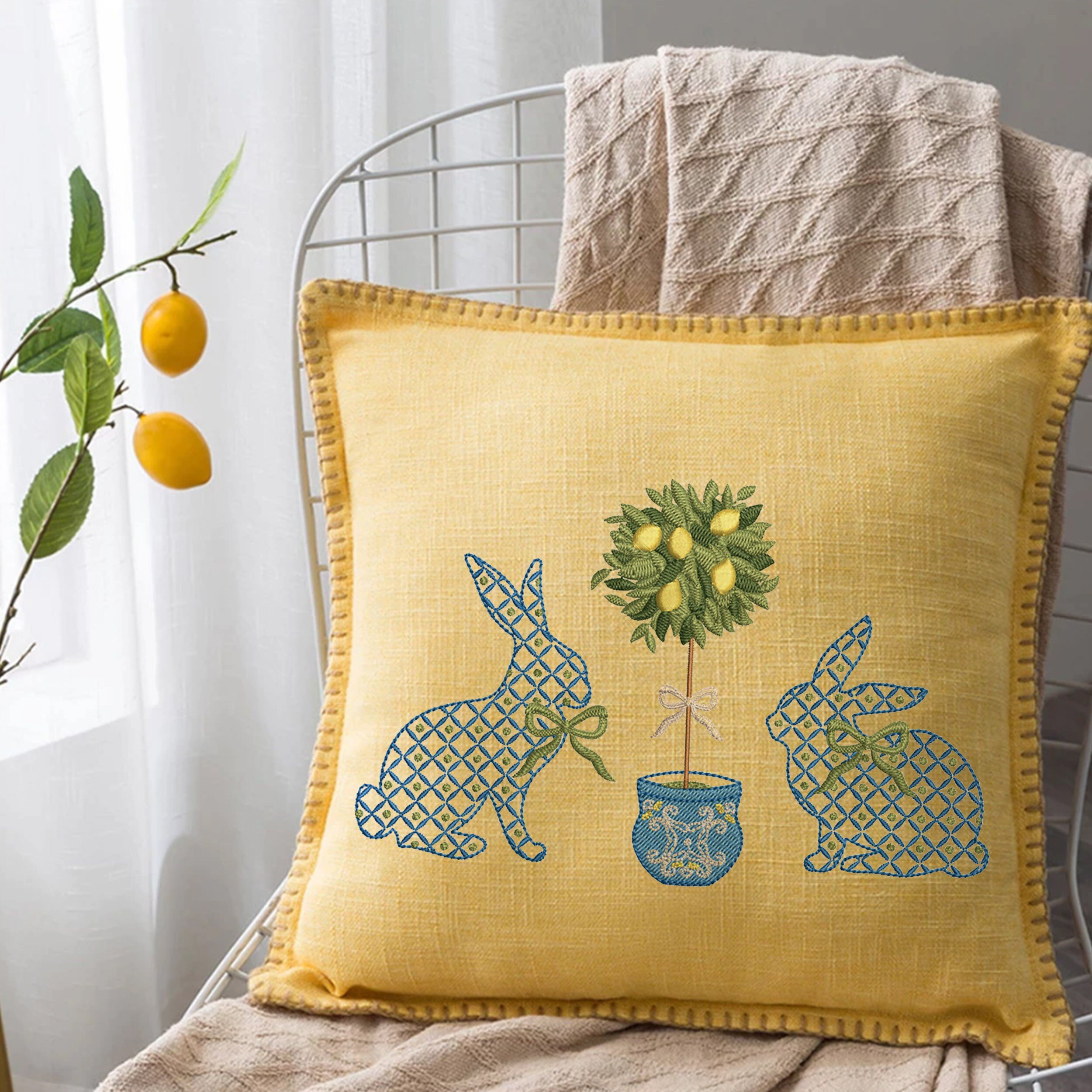 Blue and White Easter Bunnies with a Chinoiserie Lemon Tree for Machine Embroidery embroidered on a pillow