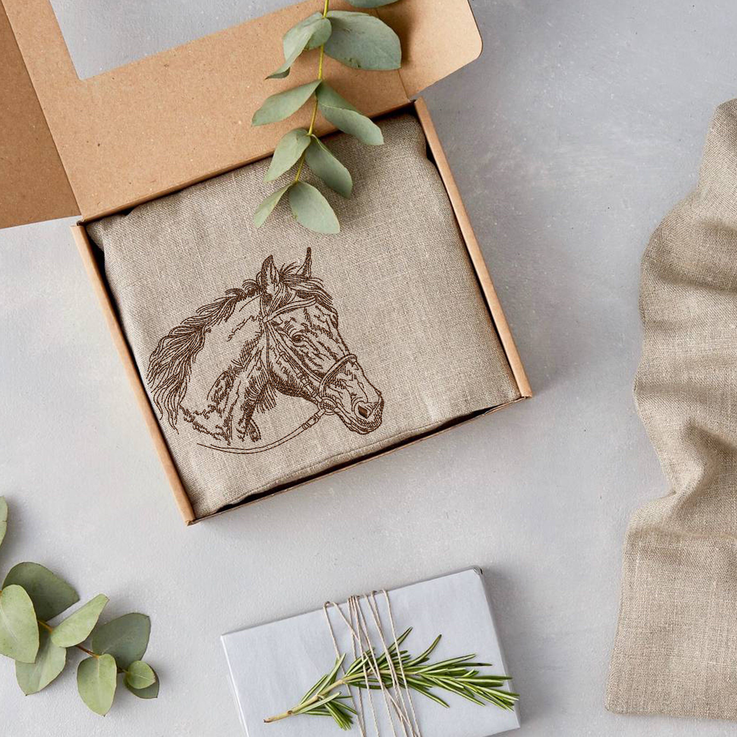 Horse Head Machine Embroidery Design embroidered on a gift idea packaging