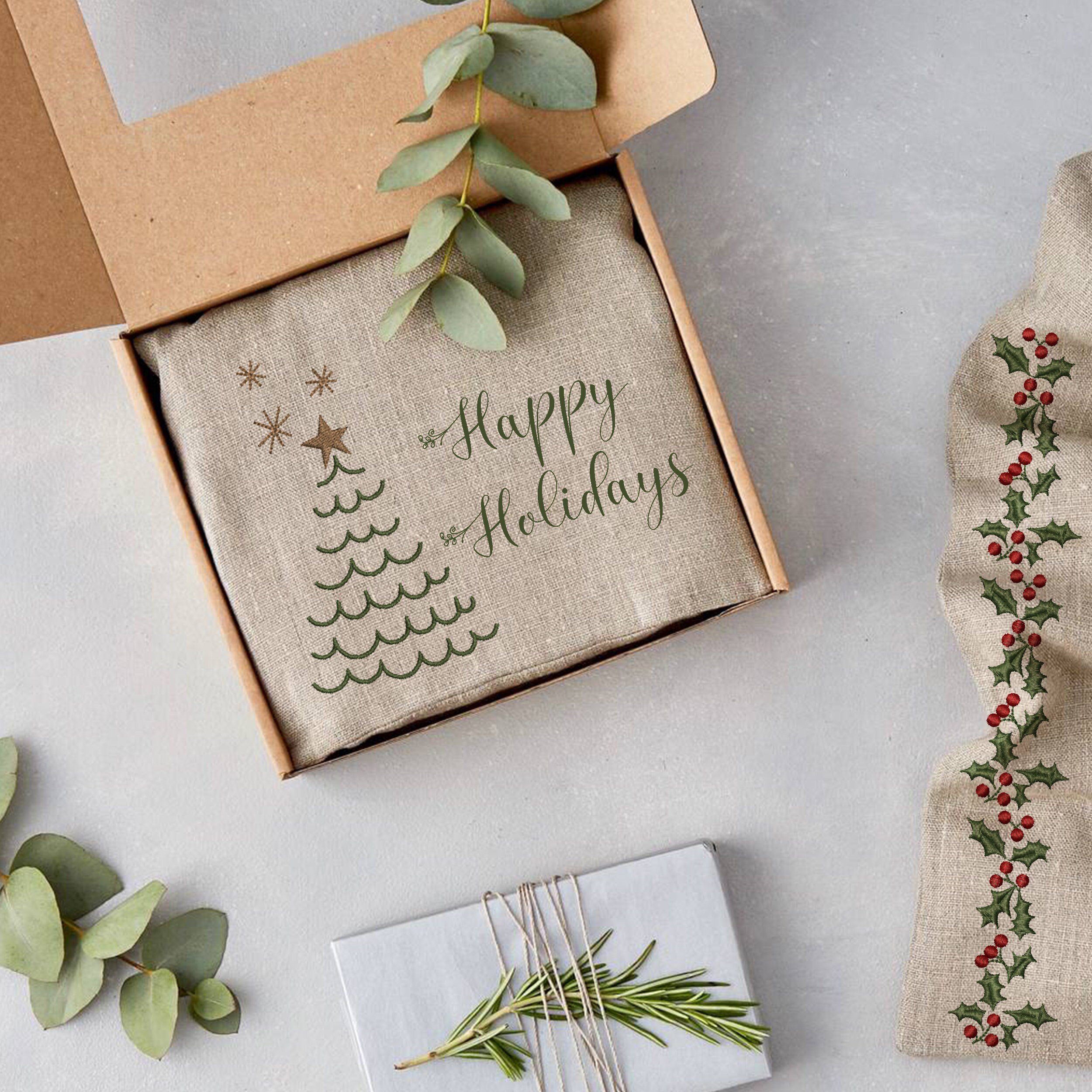 Lovely Christmas Machine Embroidery Bundle embroidered on a holiday gift packaging
