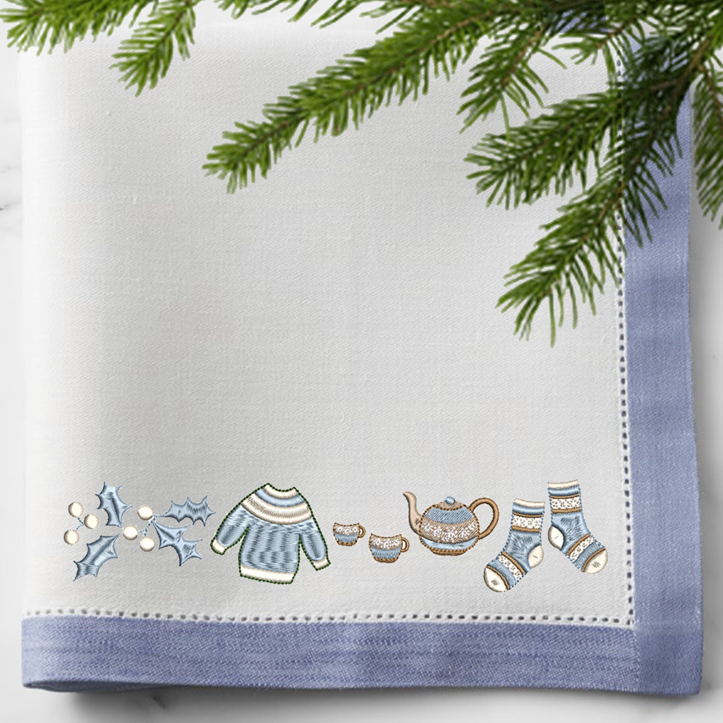 Lovely Christmas Machine Embroidery Bundle embroidered on a napkin