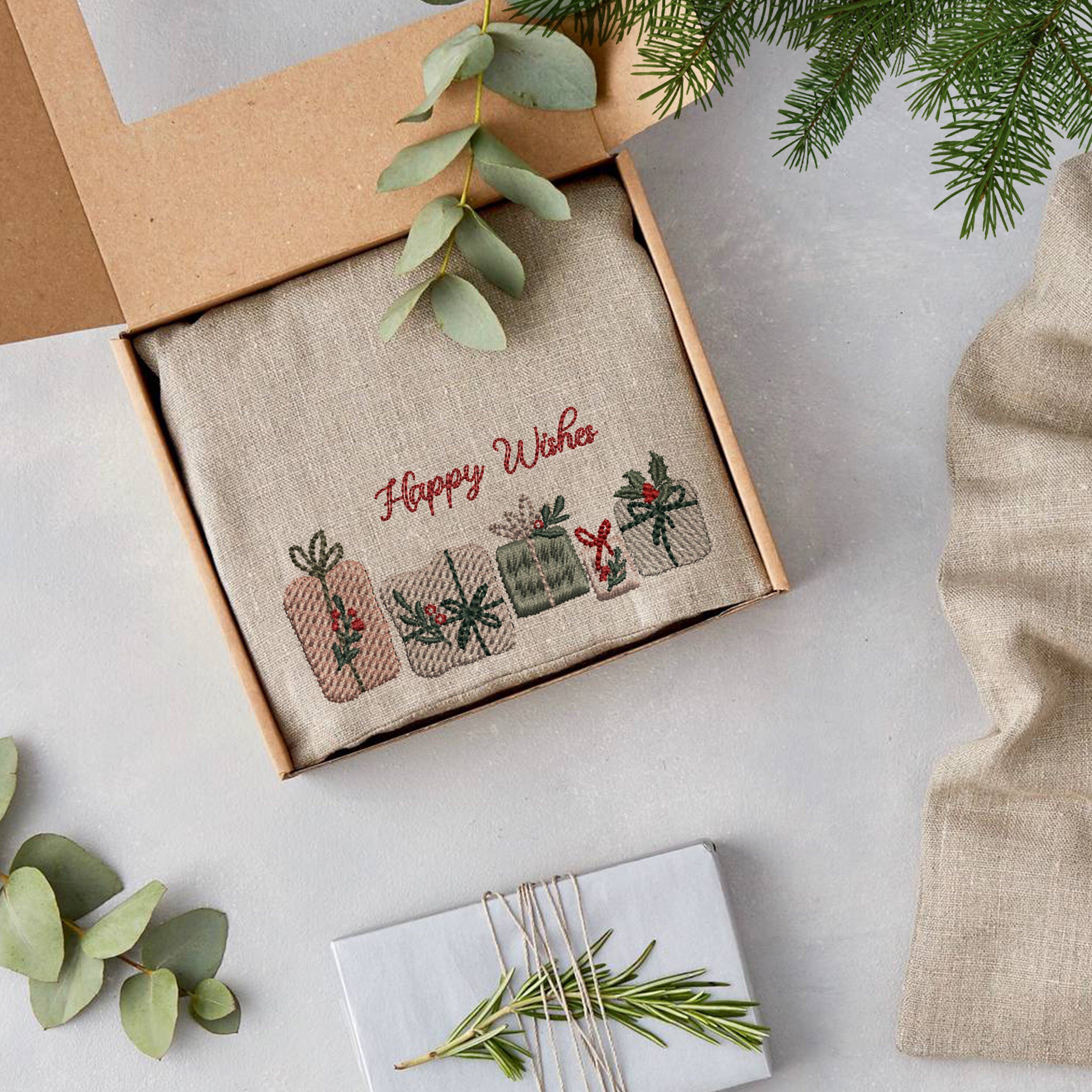 Romantic Christmas Tree Machine Embroidery Design embroidered on a gift packaging
