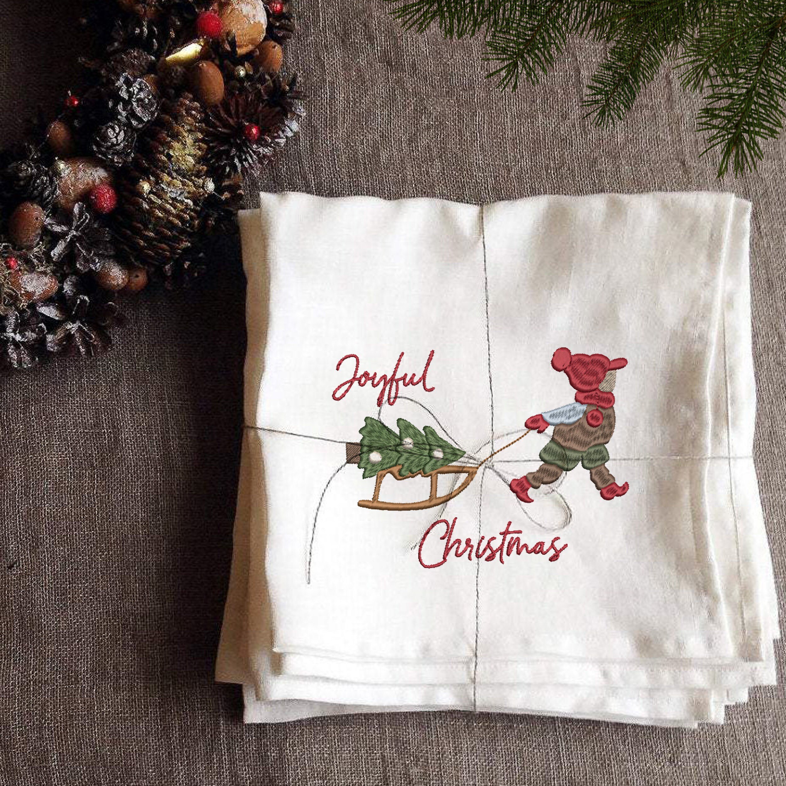 Playful Christmas Elements for Machine Embroidery File embroidered on holiday napkin