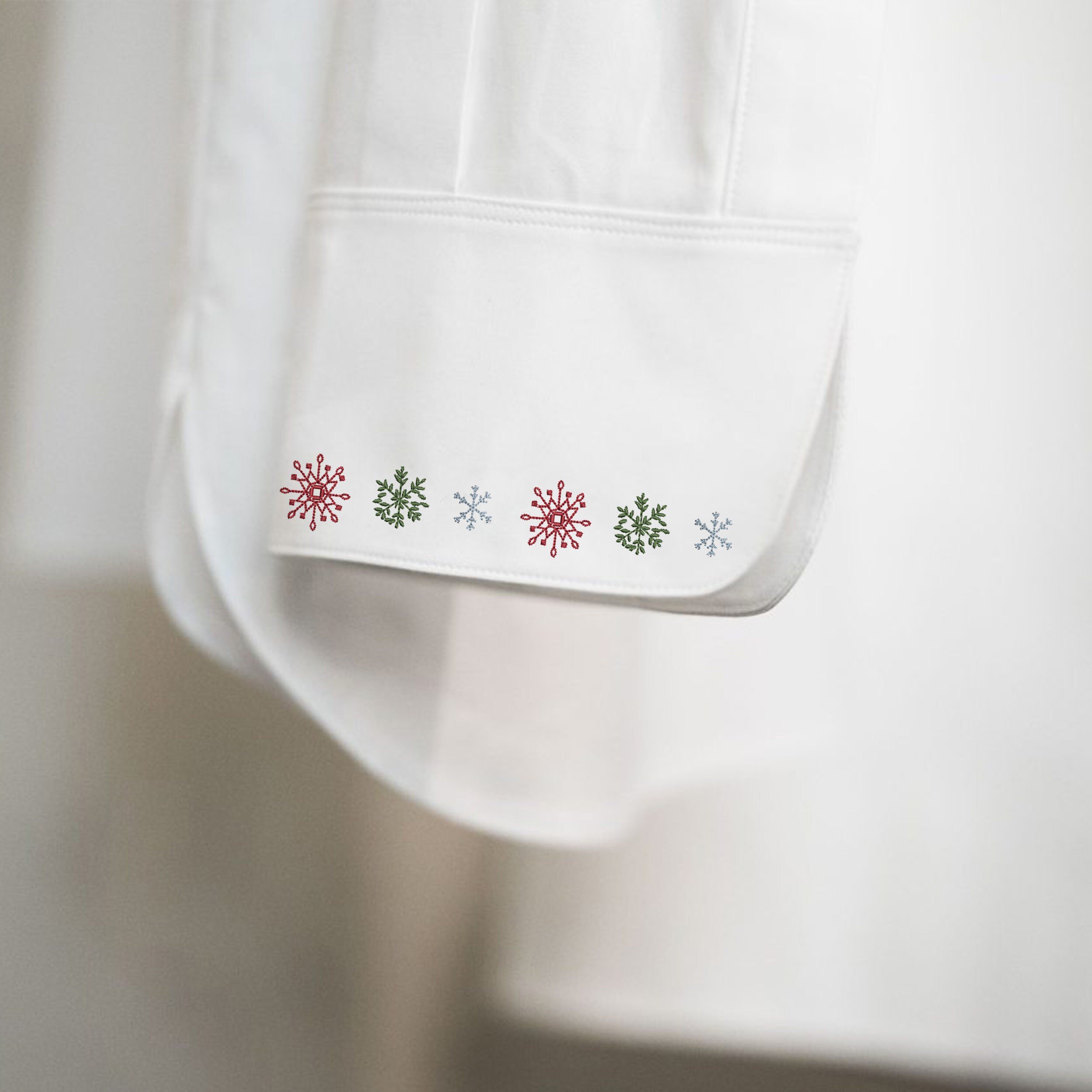 Playful Christmas Elements for Machine Embroidery File embroidered on holiday blouse
