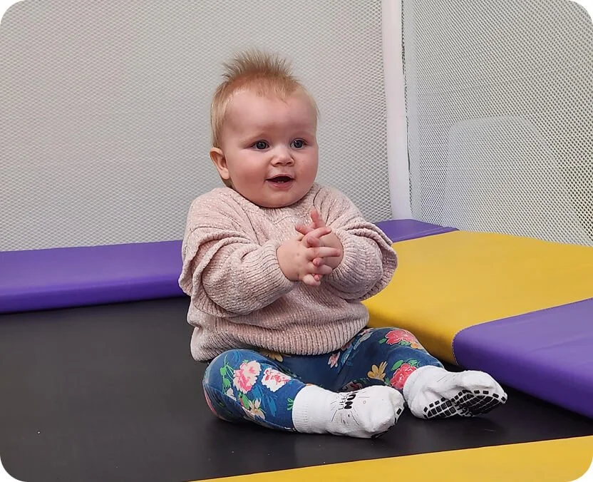 Baby playing on the trampoline at Little Nui