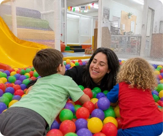 Little Nui owner playing with children in the indoor playground