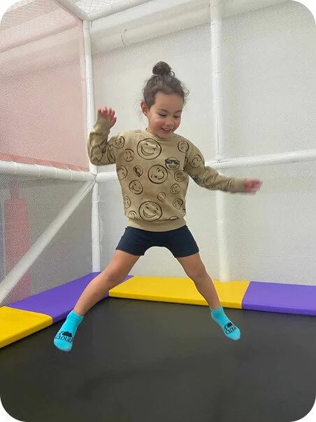 Children playing on the trampoline at Little Nui