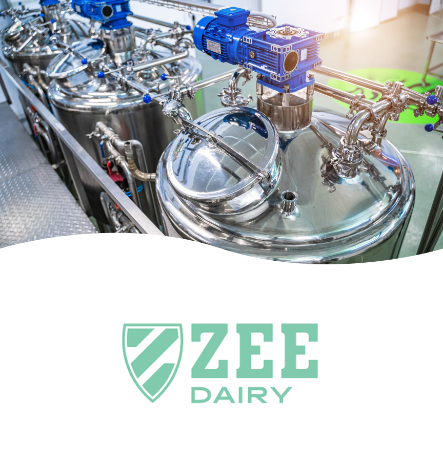 Industrial dairy processing equipment with stainless steel tanks and machinery, and the ZEE Dairy logo at the bottom.