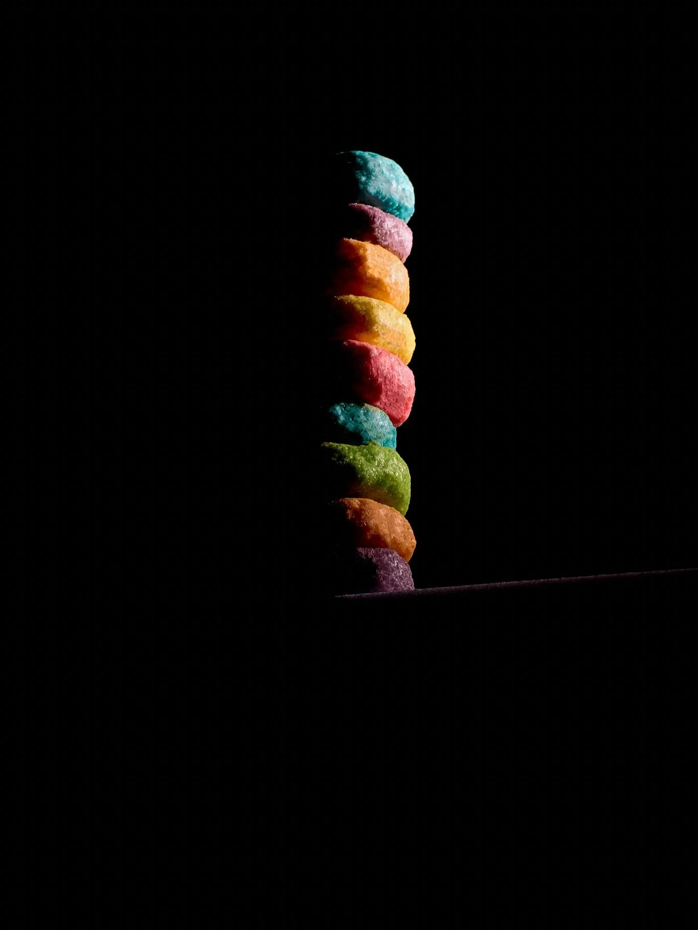 Same Froot Loop stack, different vibes. 🖤🤍💚  The original goal for this shot was to master a 3-light setup, but quickly it turned into playing with light versus dark versus colorful lighting and editing. I personally prefer the dark image. It remi