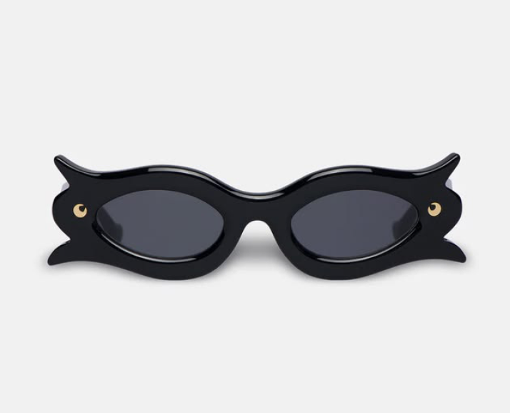 Black sunglasses with wing and eye details on the sides.