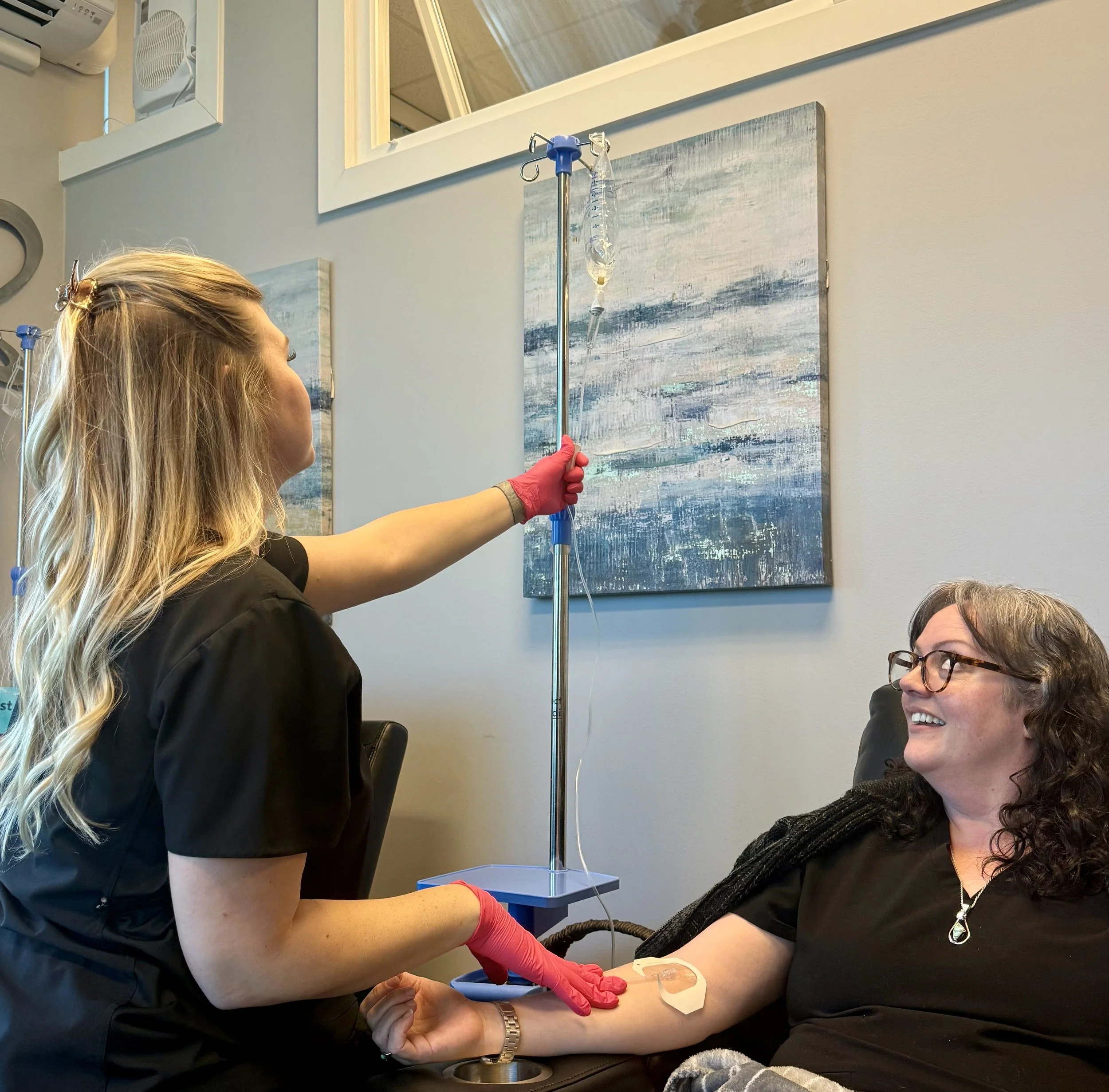 Patient receiving IV infusion therapy to boost hydration, improve energy levels, and support overall wellness with essential vitamins and nutrients.