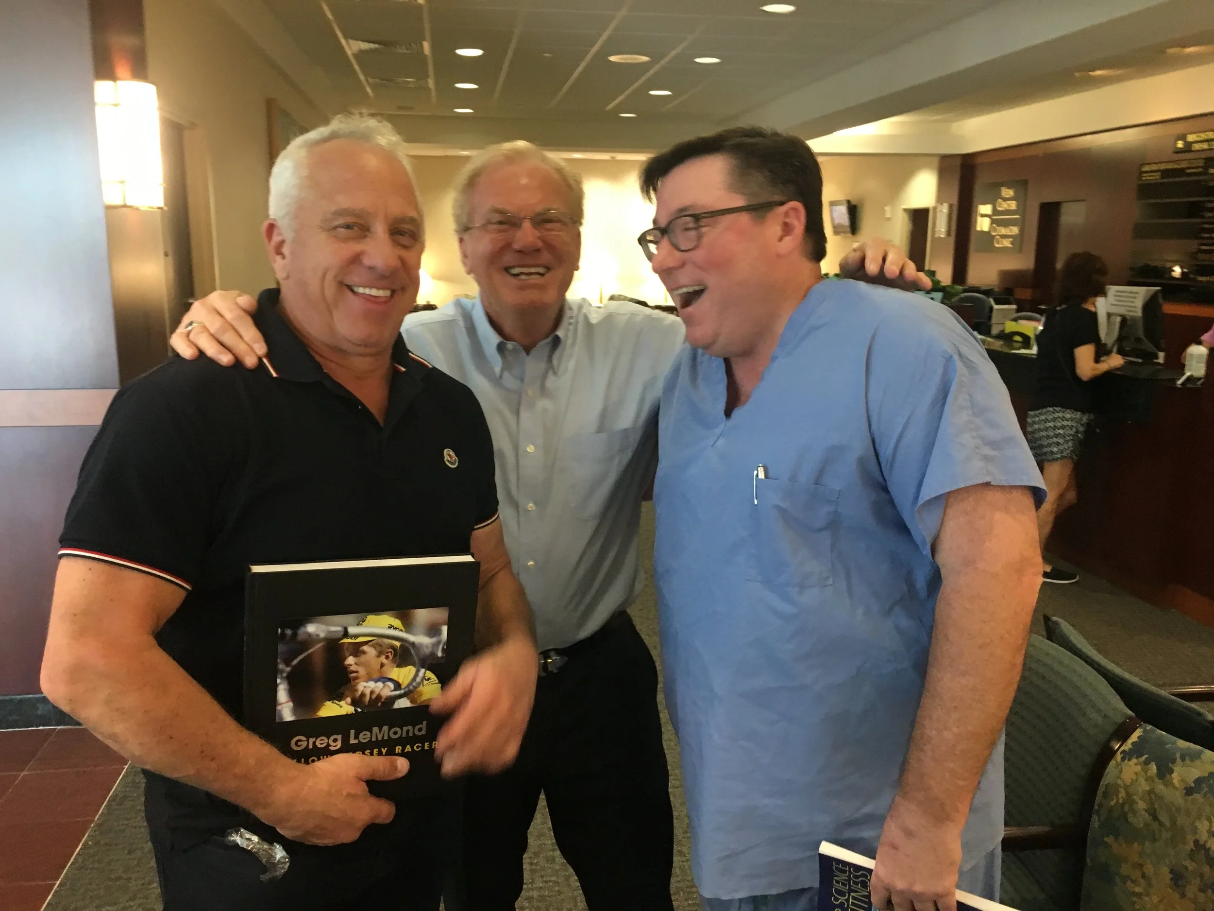 Greg LeMond with his book, Jake, Dr. Ken Plunkitt