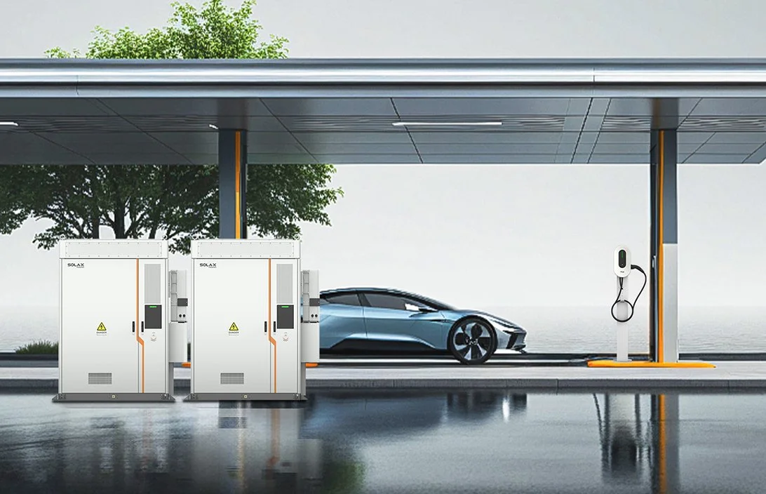 Commercial battery storage units and an EV charger at a covered charging site