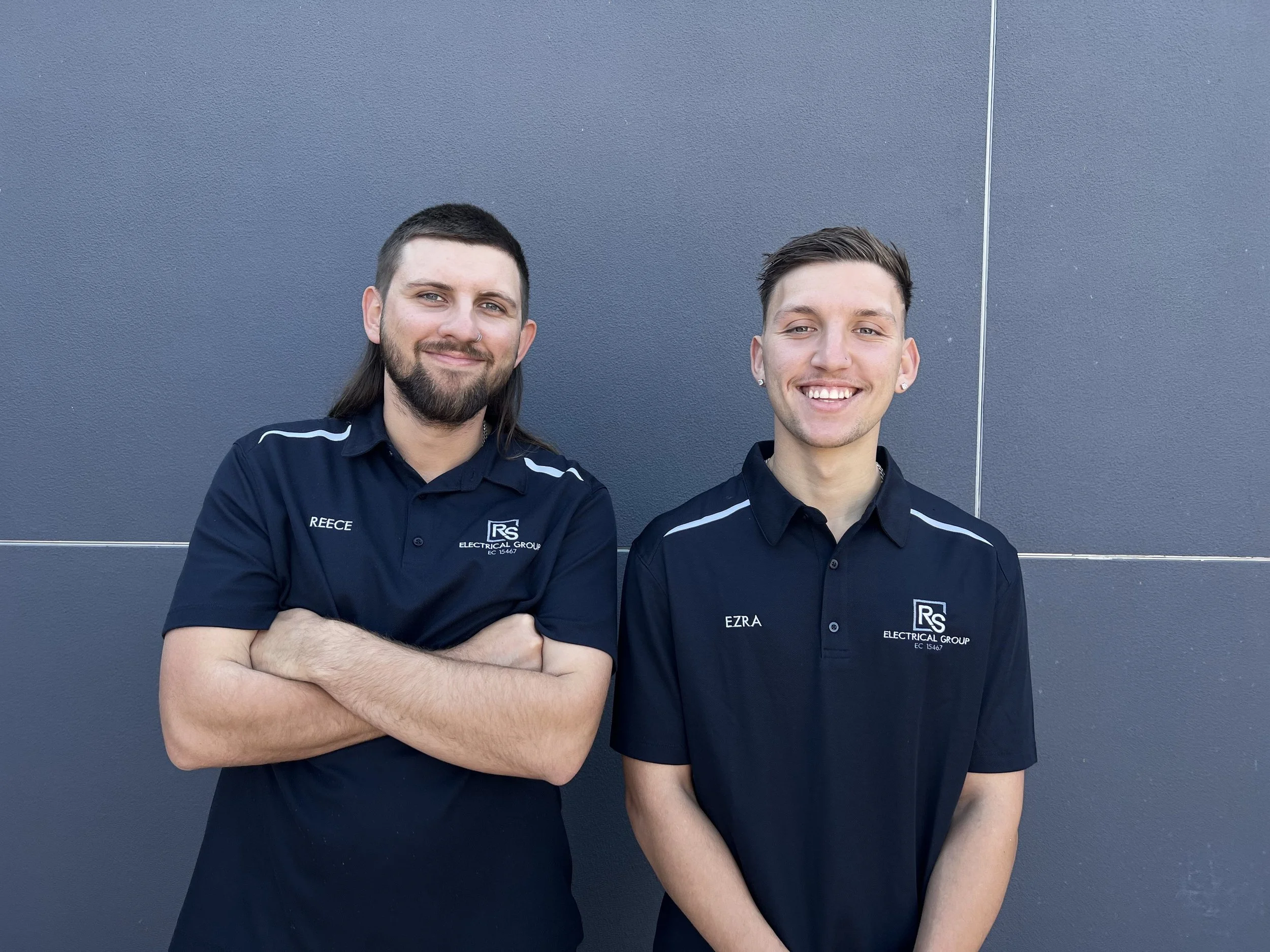 Two RS Electrical Group team members wearing branded uniforms