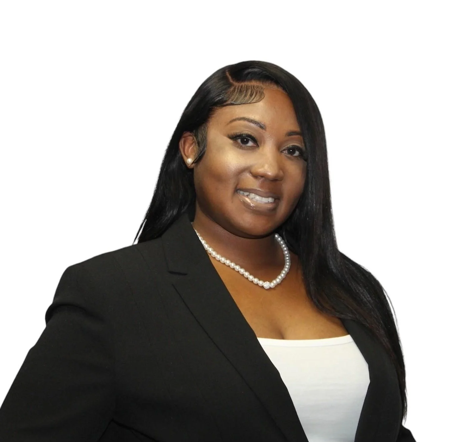 A woman with long black hair, wearing a black blazer, white top, pearl necklace, and pearl earrings, smiling confidently against a white background.