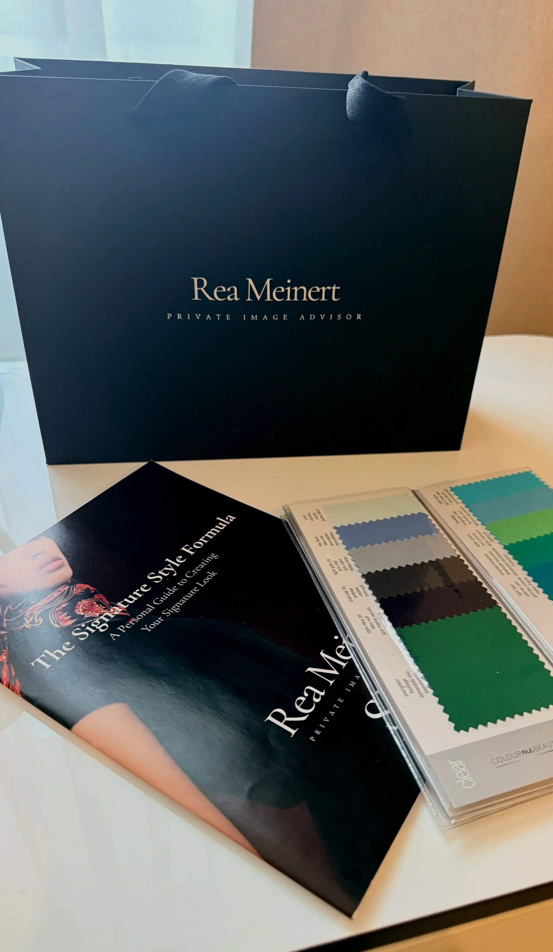 Style Journey by Rhea consultation materials, including a personalised style guide, colour swatches, and image consultation resources.