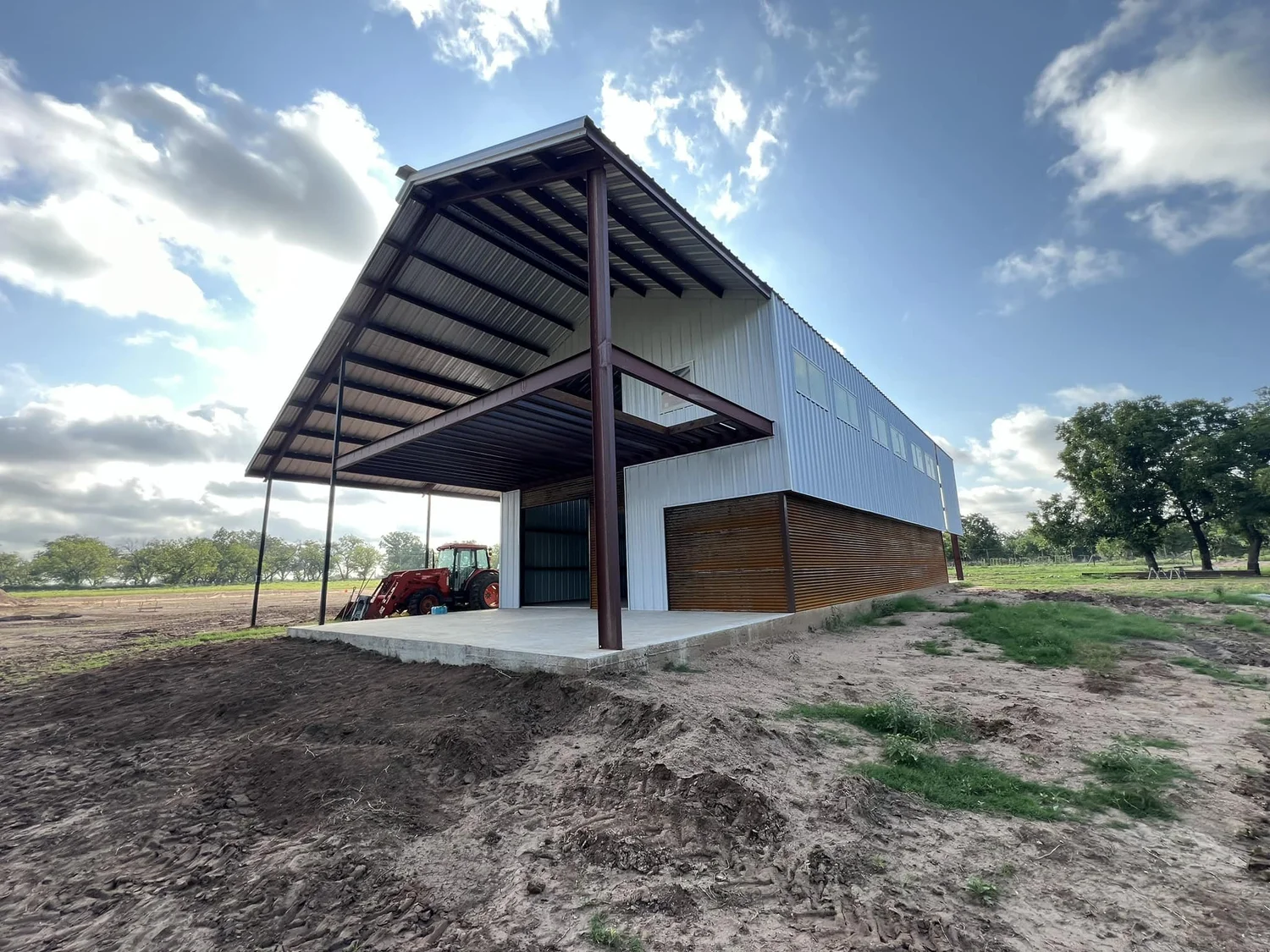 Two-story flex building with red iron overhang in Bend, TX