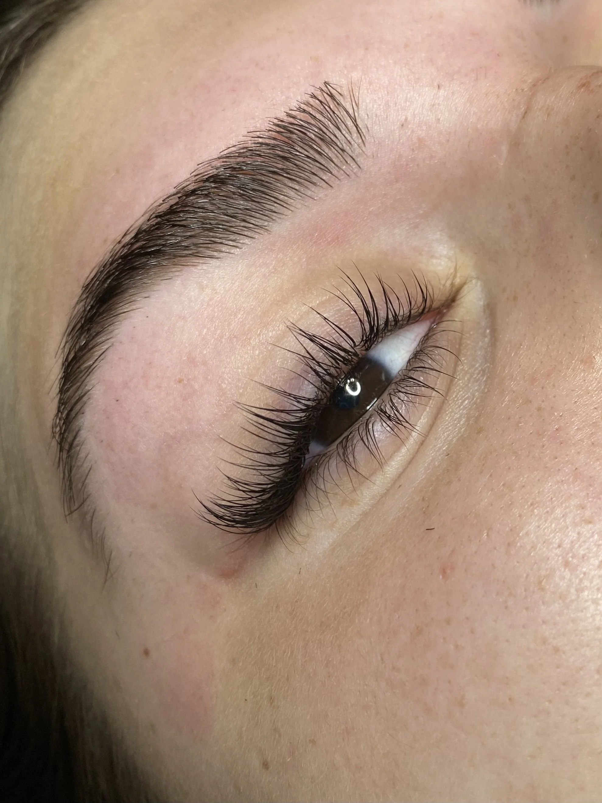 Woman with long lashes who just received a lash lift