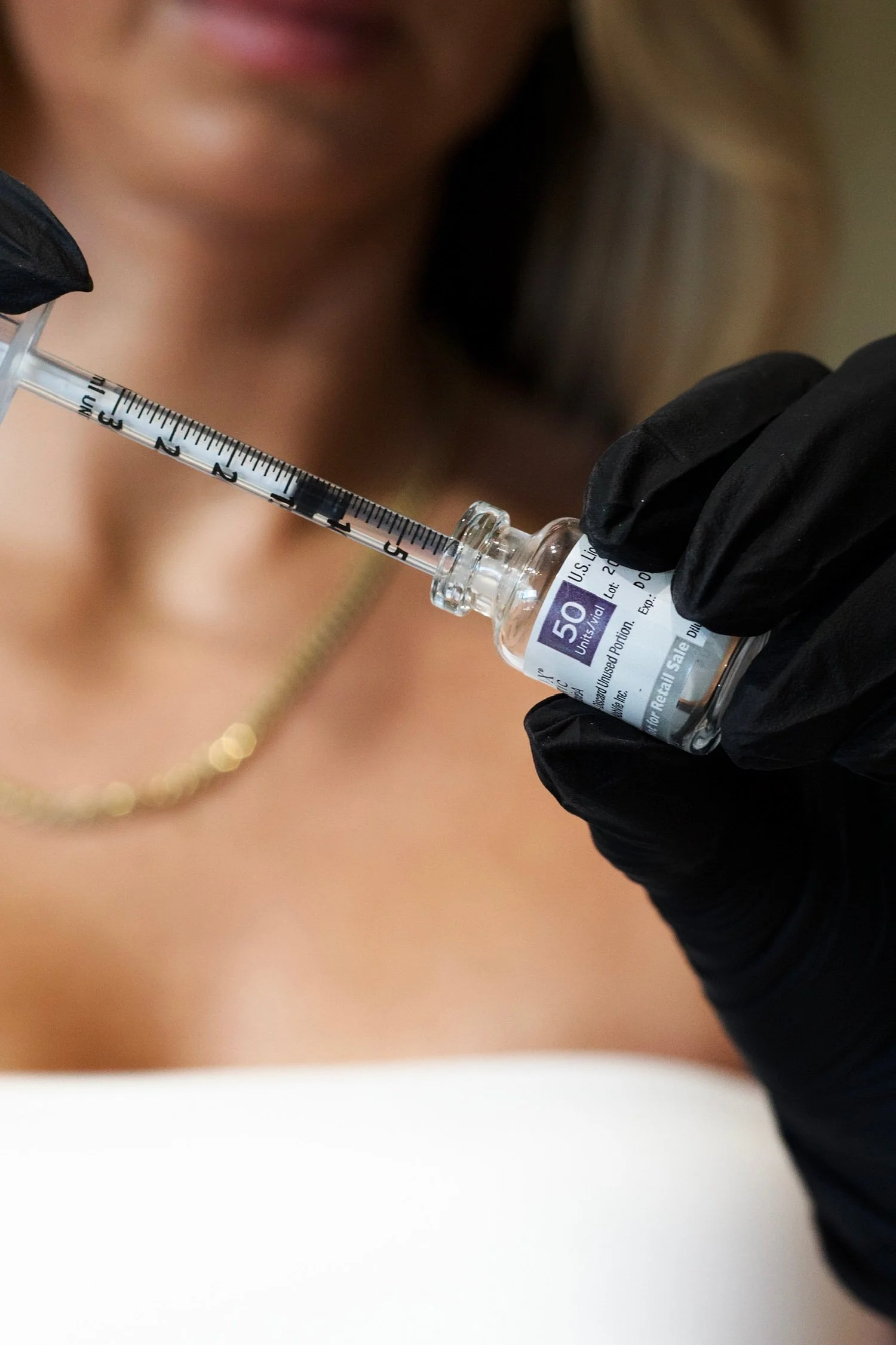 Jennifer preparing a syringe of neuromodulator for an injectable treatment at VAIN OBX