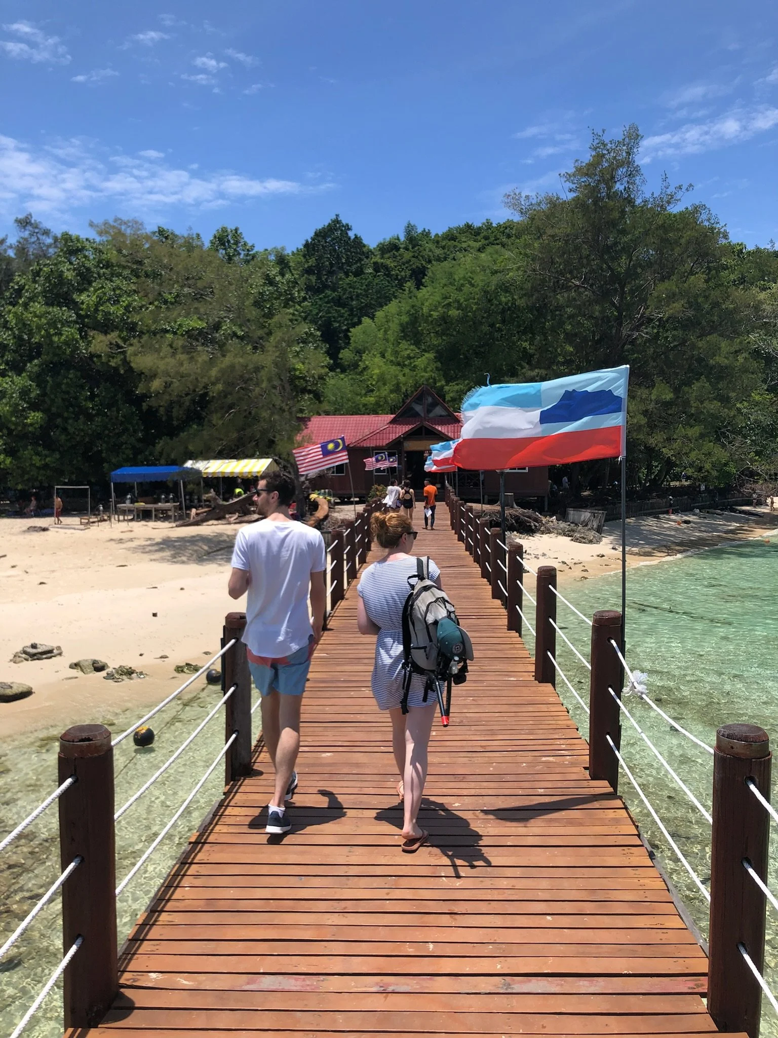 People walking ashore in Borneo on an epic escapes trip to malaysia