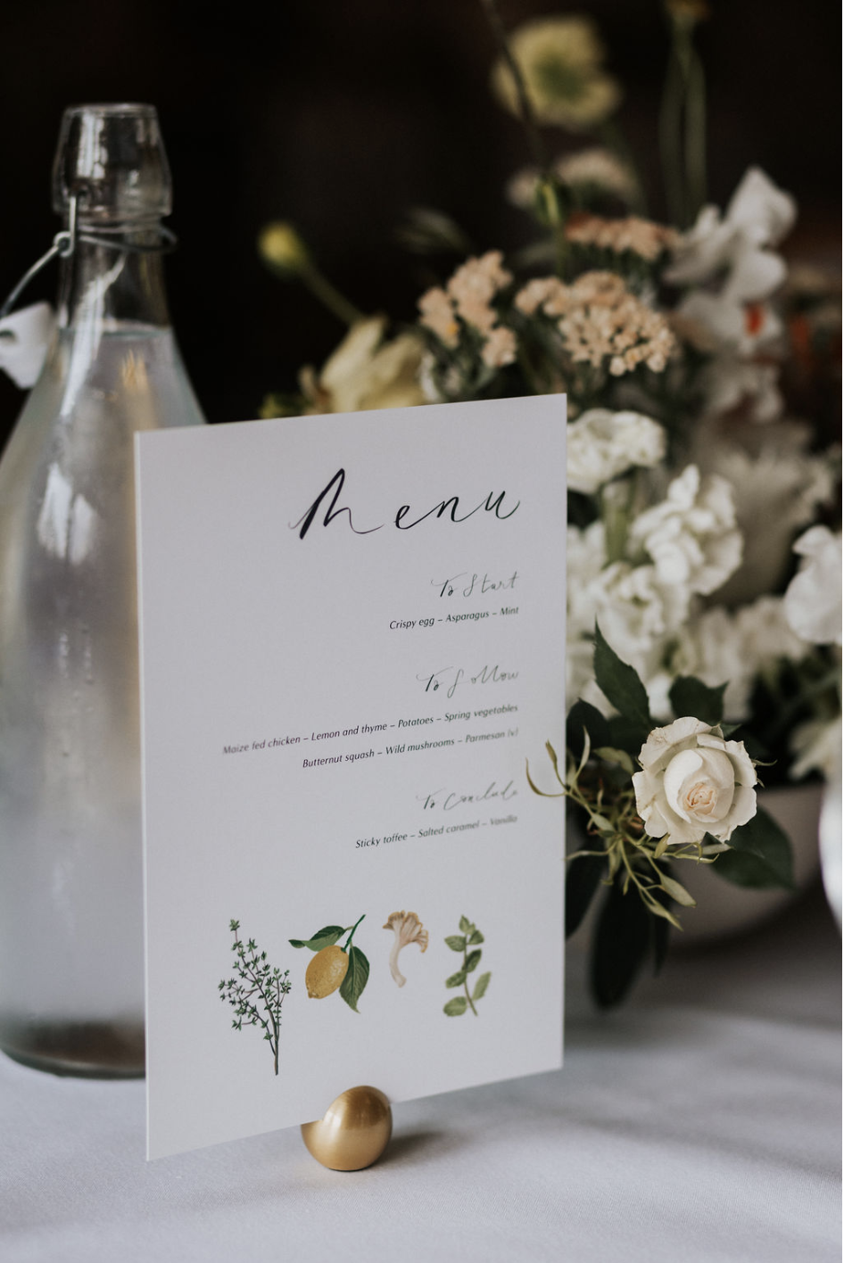 Illustrated wedding menu lemons herbs