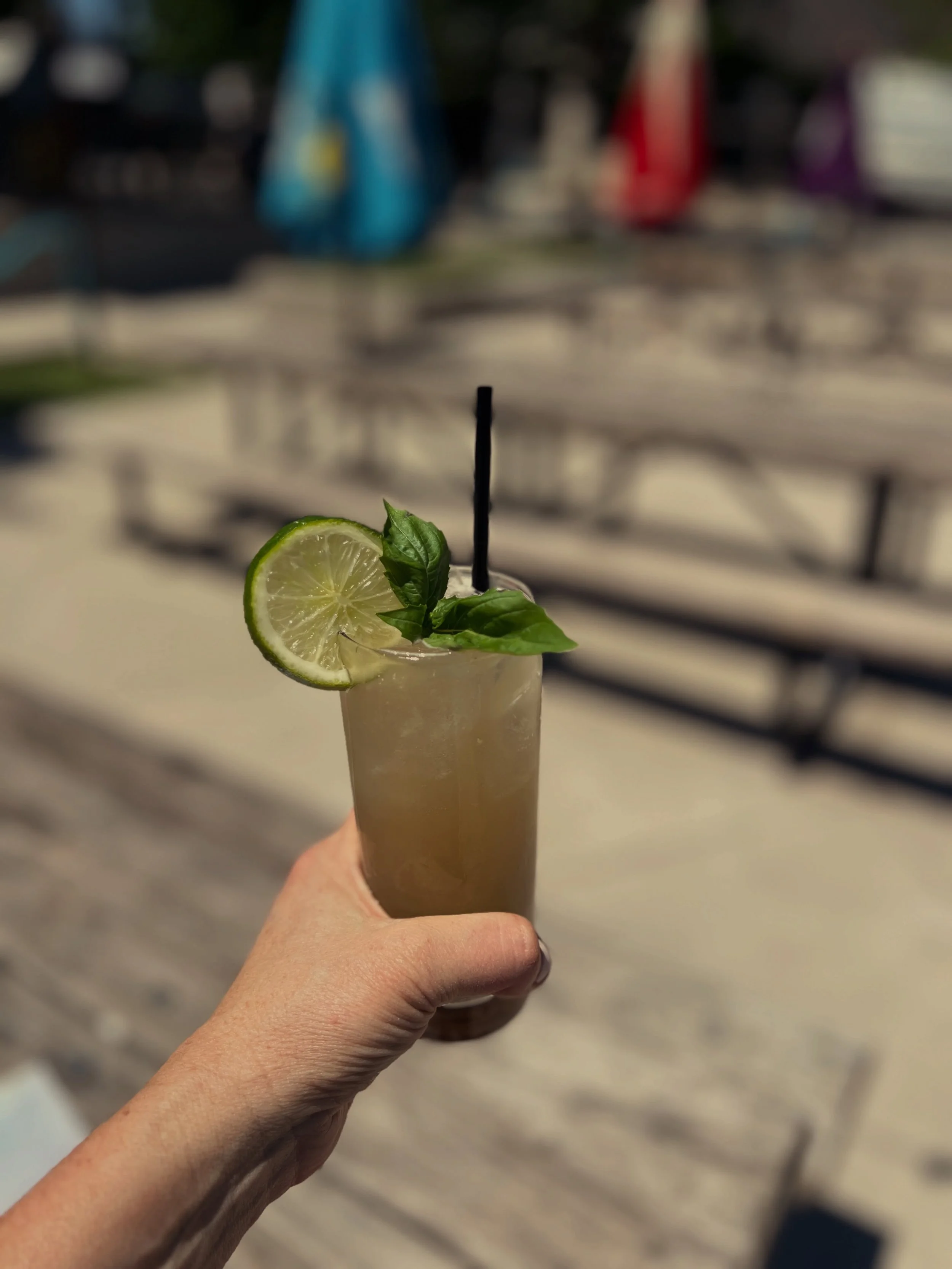 Don&rsquo;t let some rain dampen your summer kickoff &mdash; grab one of our new sunshine-y cocktails (or zero proof versions) and join us inside! #woodschapelbbq #summerhillatl #margarita #mezcalita #frozendrinks