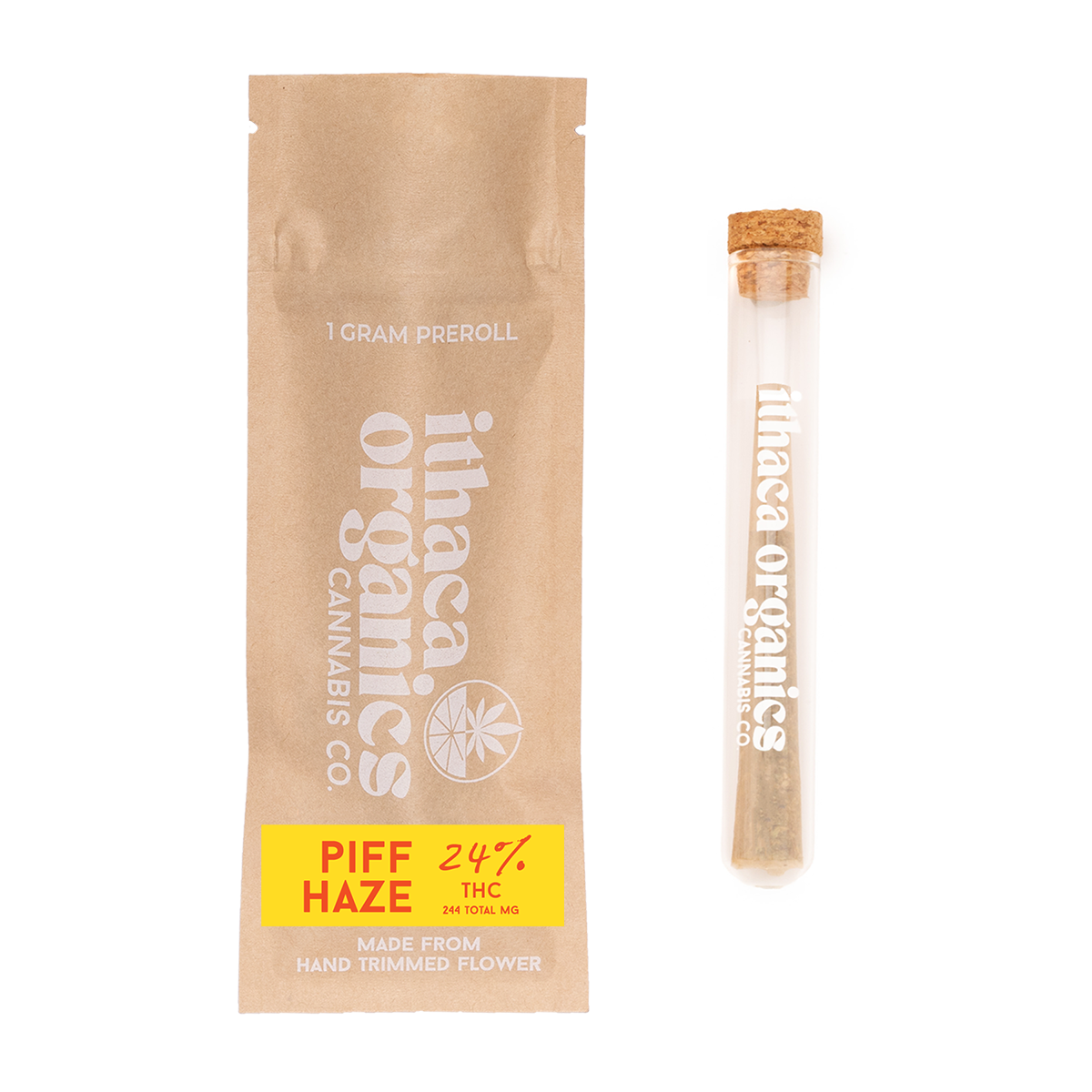 A beige paper package with the label 'Inaha Organic' and the words '1 gram preroll'. Next to it is a glass tube with a cork lid, also labeled 'Inaha Organic'. The package has a yellow sticker with red text that reads 'PIFF HAZE 24% THC 244 TOTAL MG' and states it is made from hand-trimmed flower.