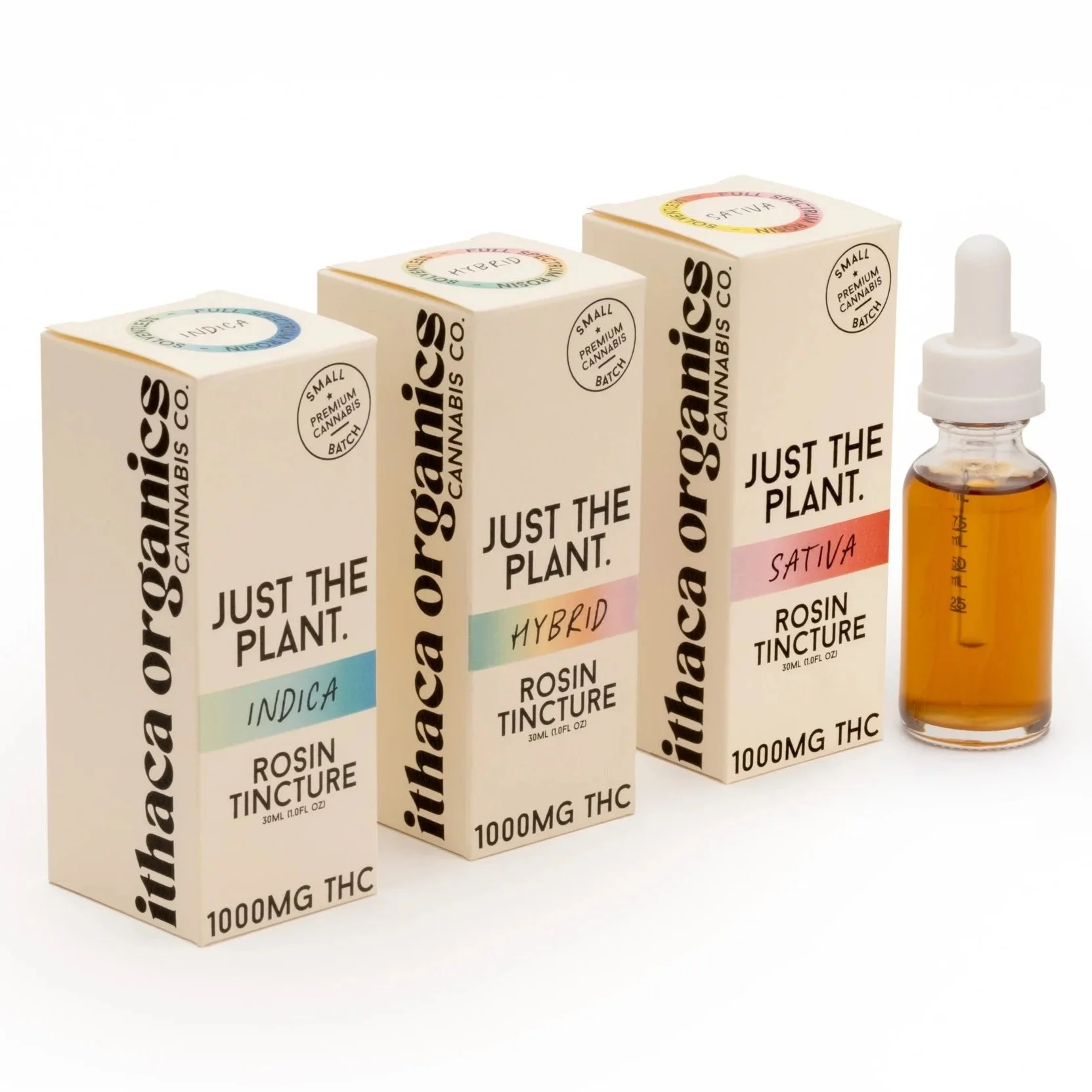 Three boxes of Ithaca Organics cannabis rosin tincture in indica, hybrid, and sativa varieties, with a dropper bottle of the tincture beside them.