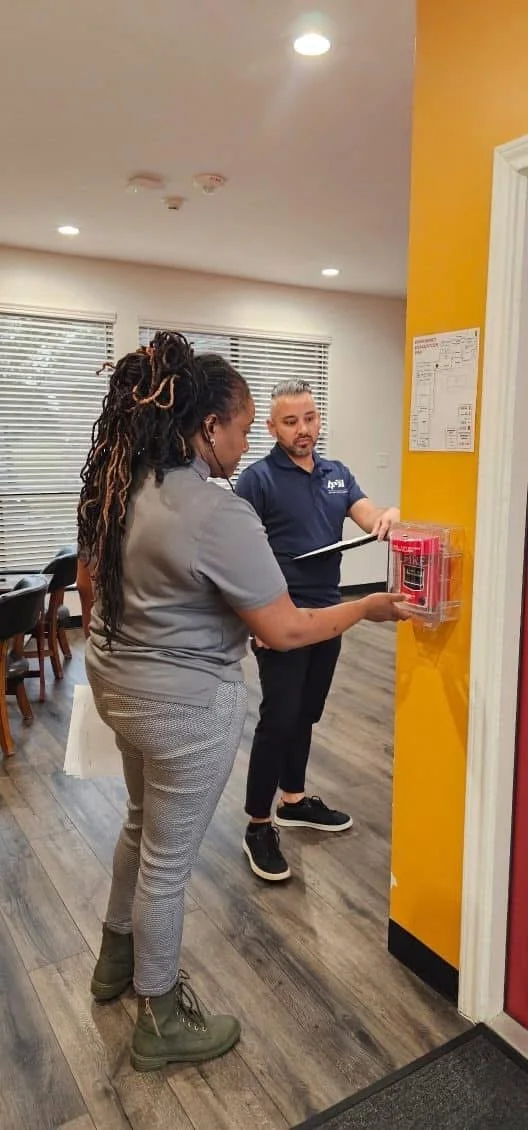 Fire Safety Compliance Walkthrough: Kim and Chris conducting a hands-on fire extinguisher and life safety inspection, verifying proper placement, accessibility, and code compliance before a facility opens its doors.