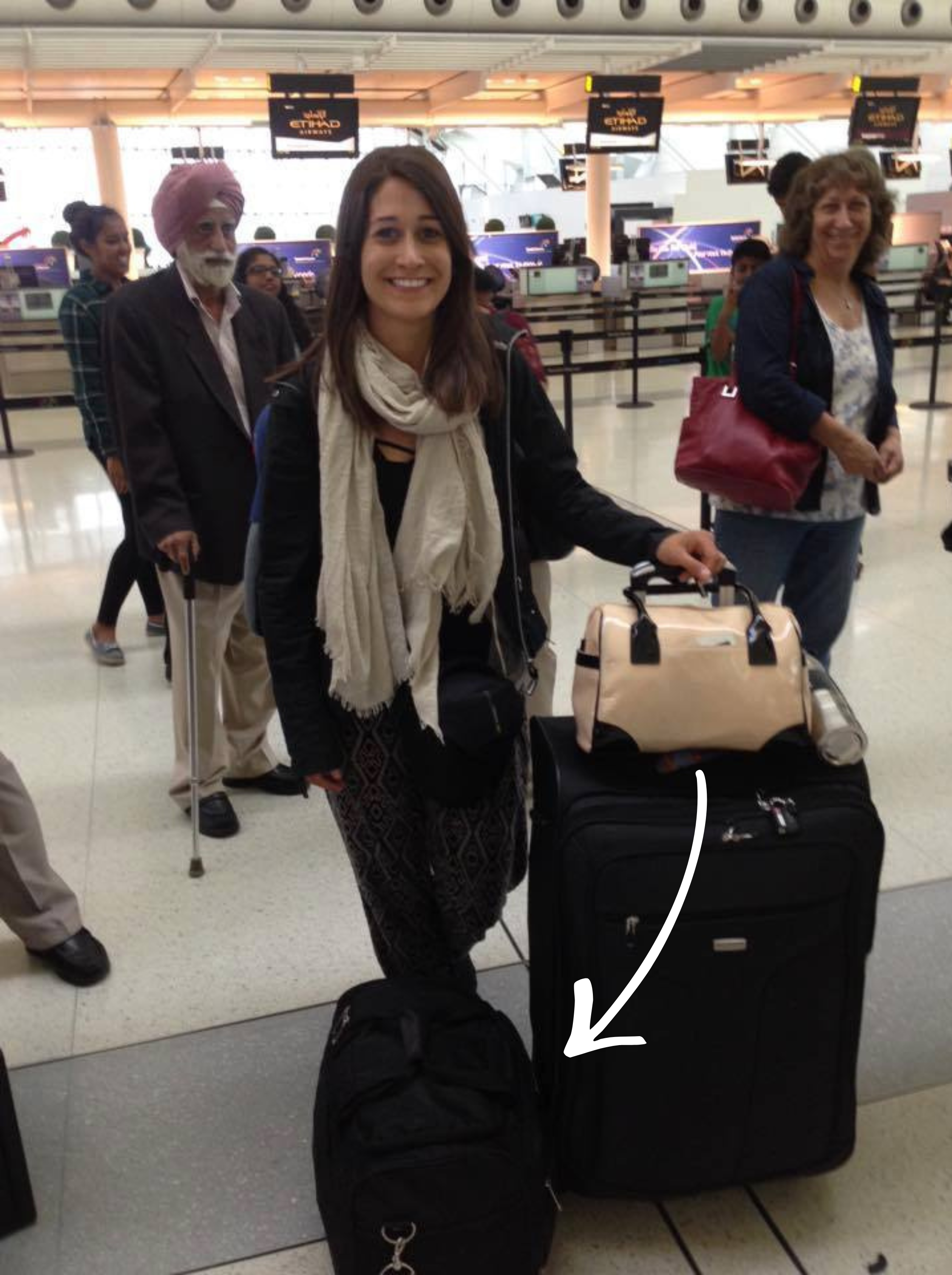 Kate with Samsonite Carryon Case.png