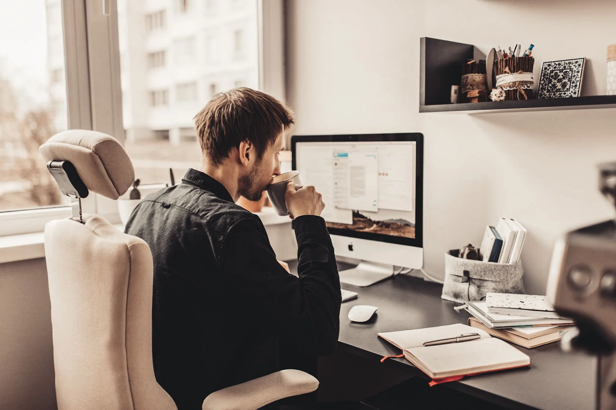 Professional working independently on laptop at home