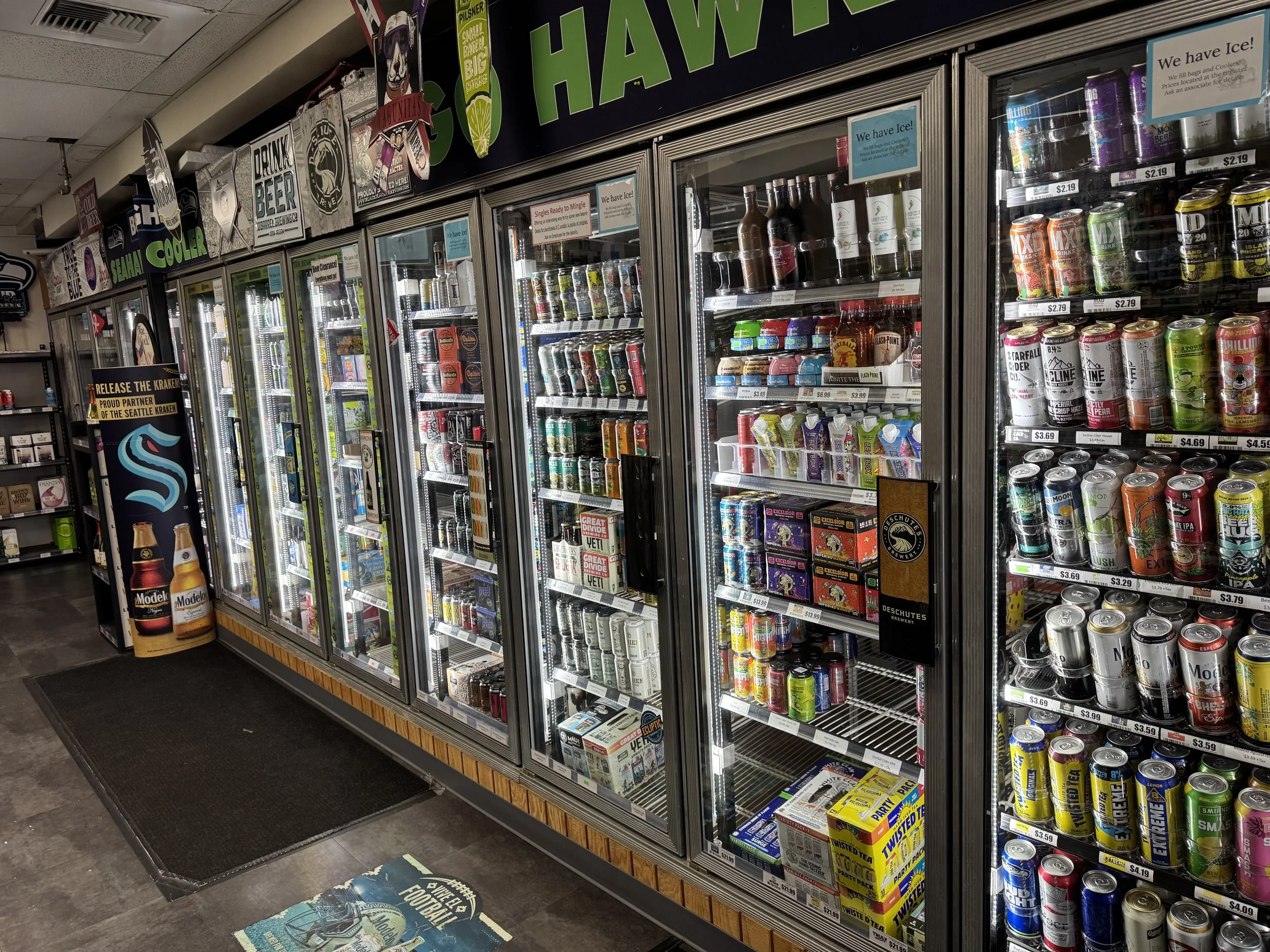 Refrigerated drink display with assorted beverages