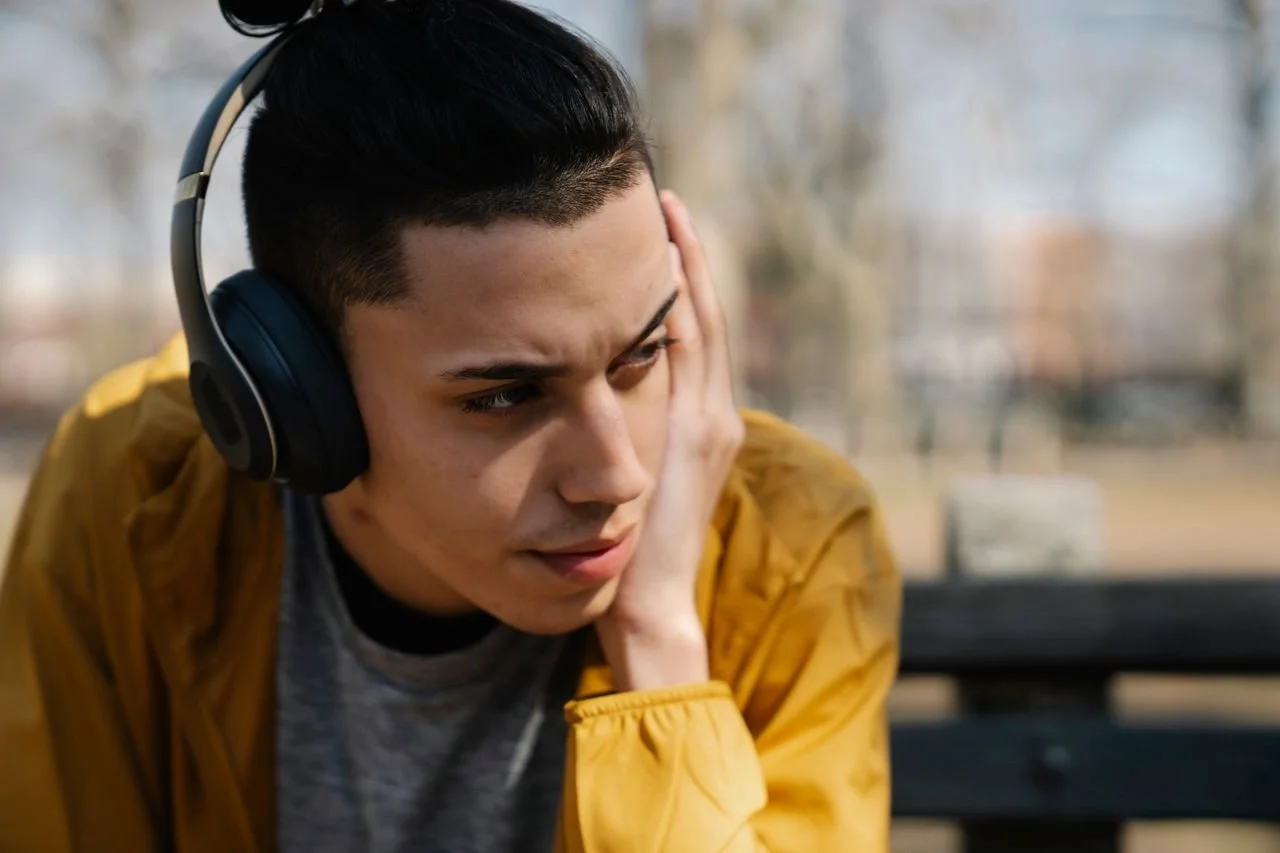 male-teen-listening-to-music-in-headphones