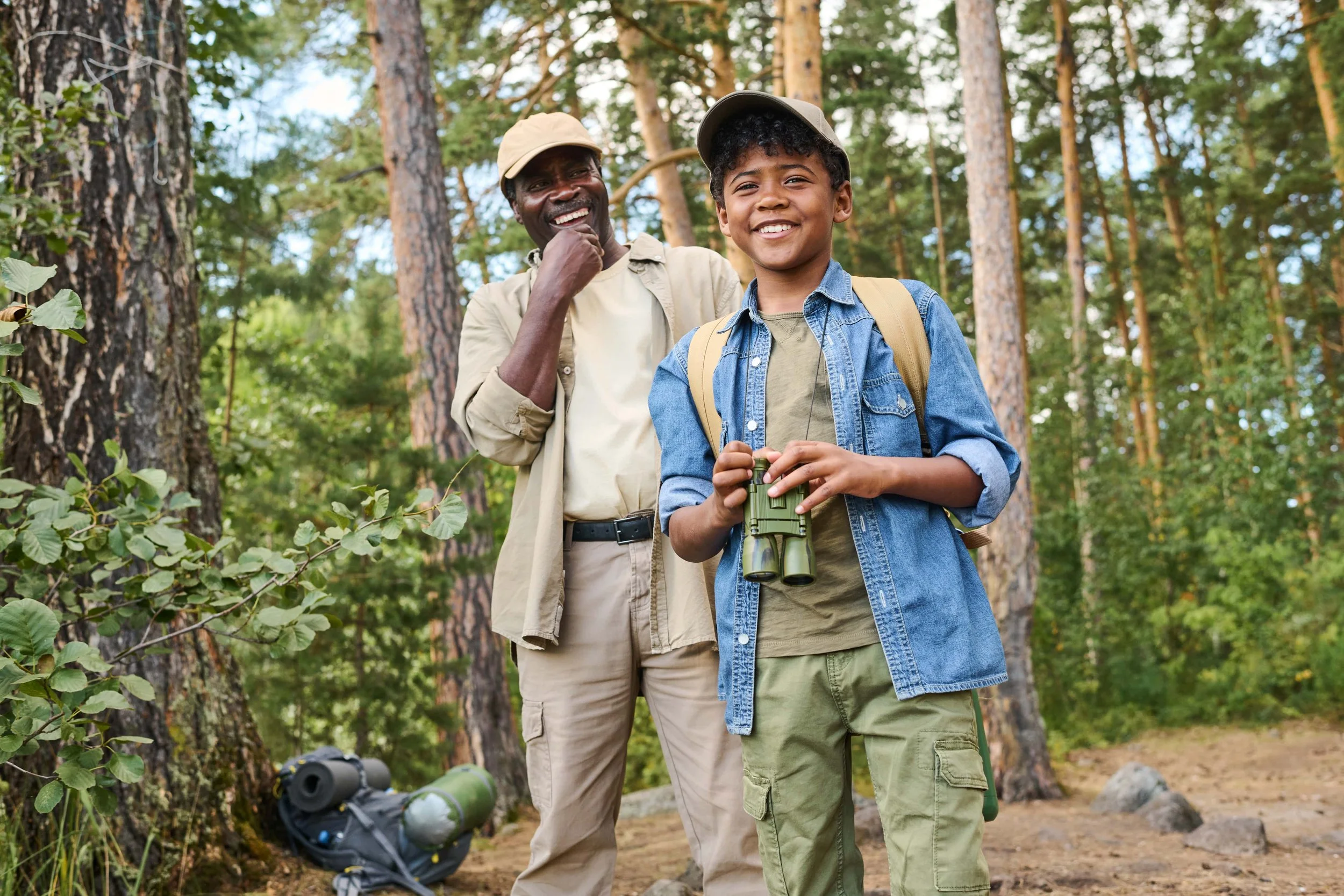 two-cheerful-hikers-with-backpacks-standing-in-pin-2023-11-27-05-16-24-utc-min.jpg