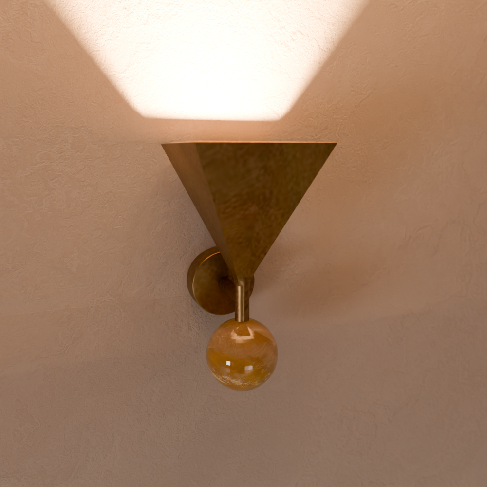 Close-up of a wall-mounted ceiling light fixture with a gold triangular shade and a decorative glass globe hanging below.