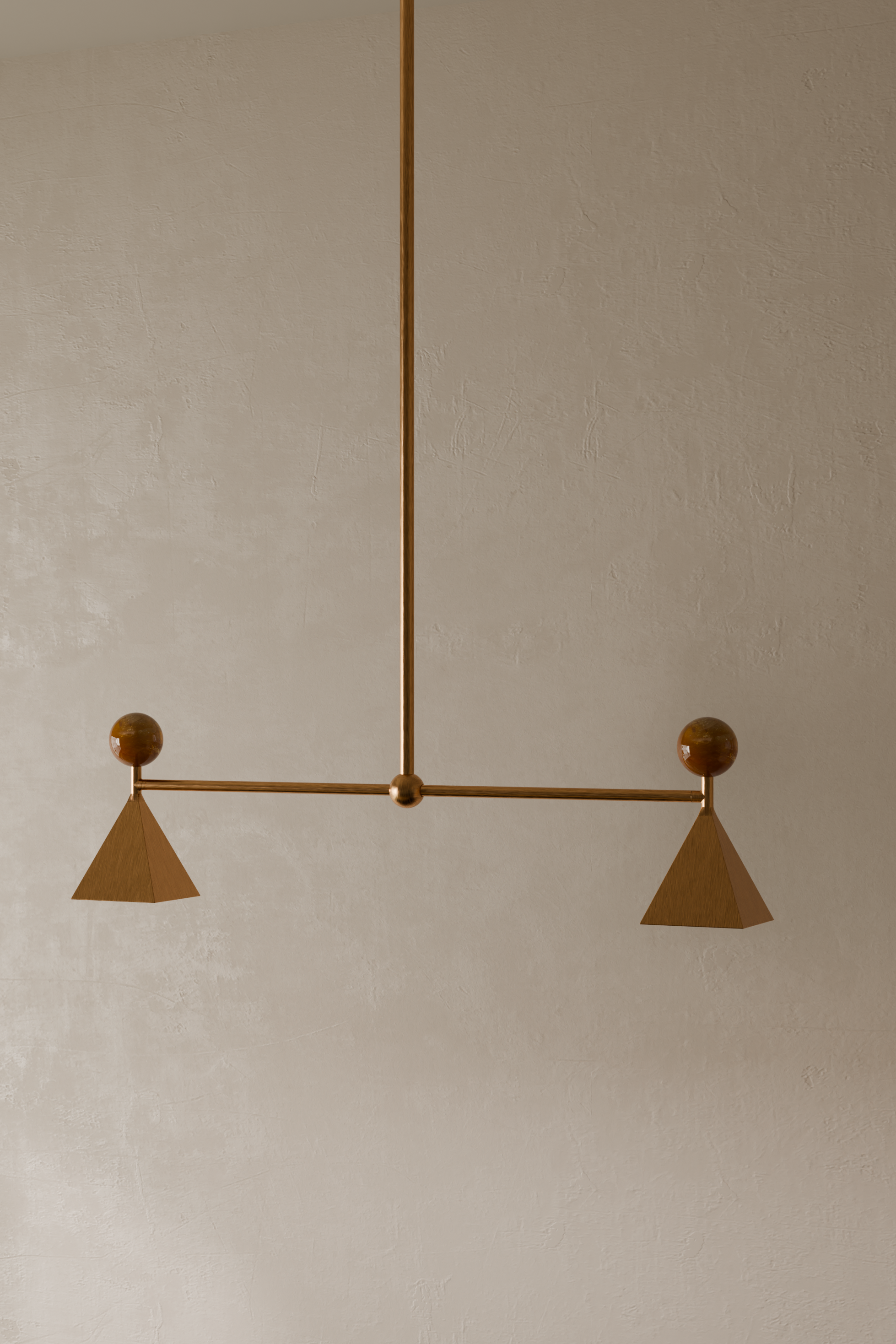 Mid-century modern chandelier with geometric wooden design and cone-shaped shades hanging from a wall with textured beige paint.