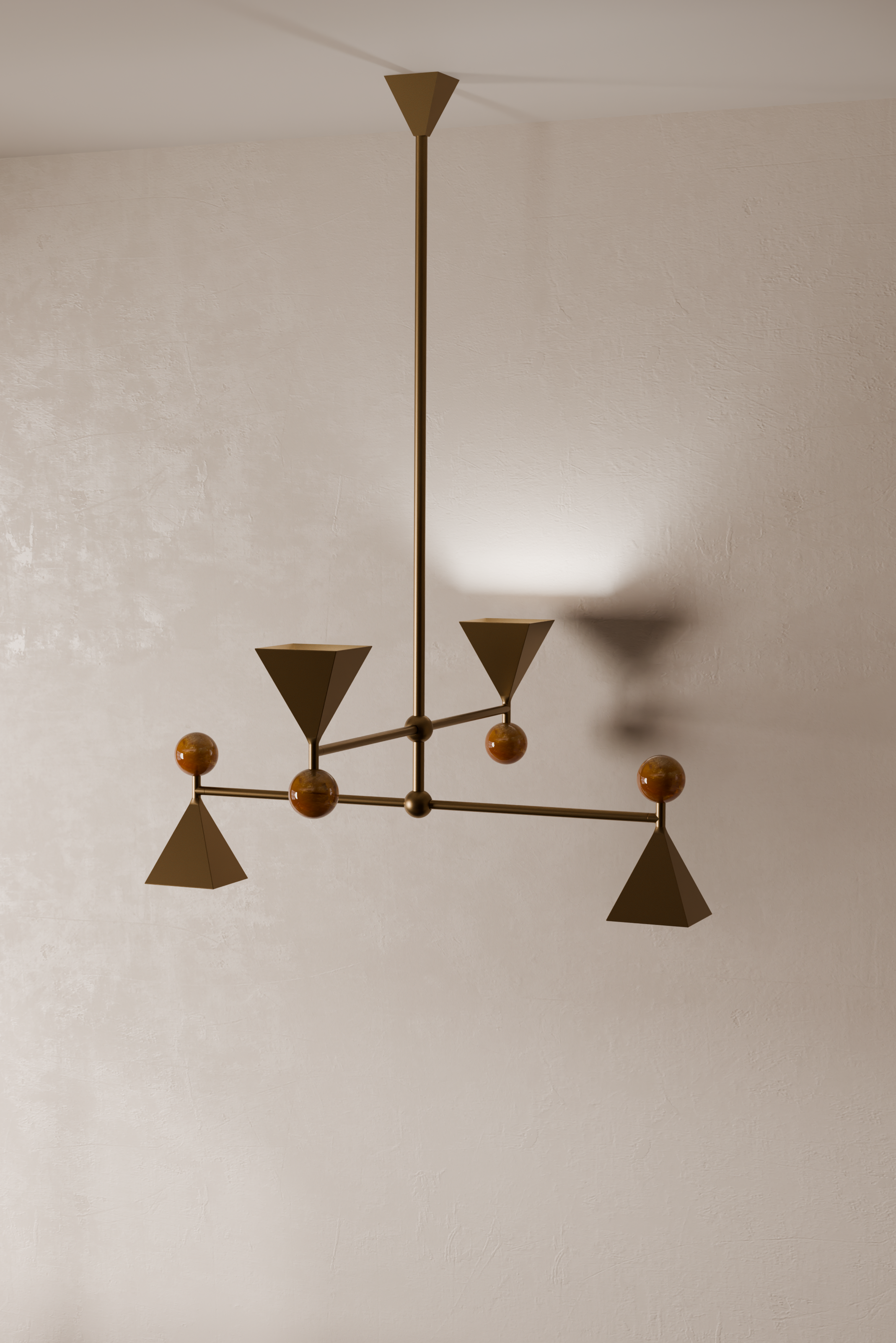 A modern chandelier with geometric shapes hanging from a central rod, mounted on a textured off-white ceiling.