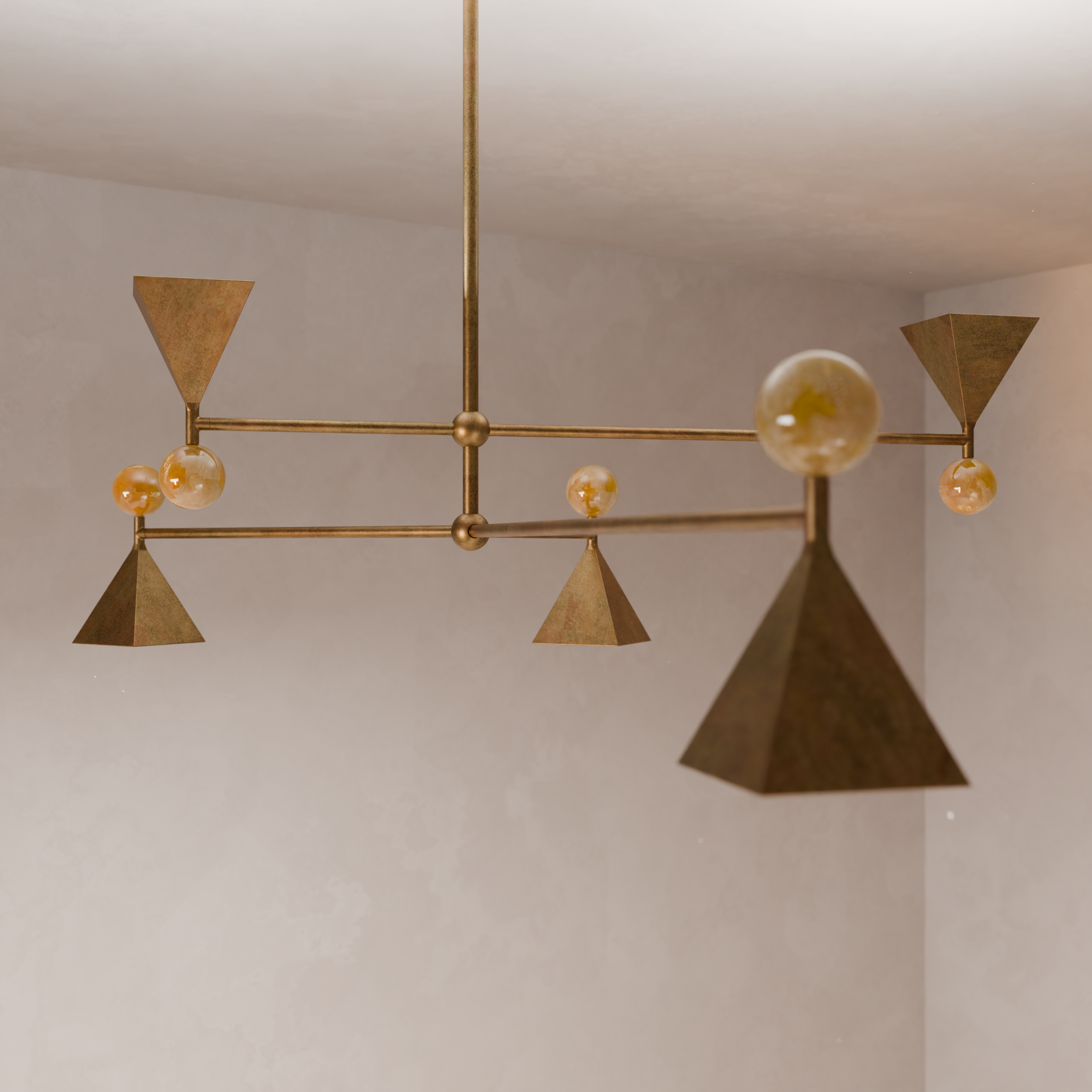 Close-up view of a modern ceiling light fixture with geometric metal shapes and spherical bulbs, mounted on a white ceiling.
