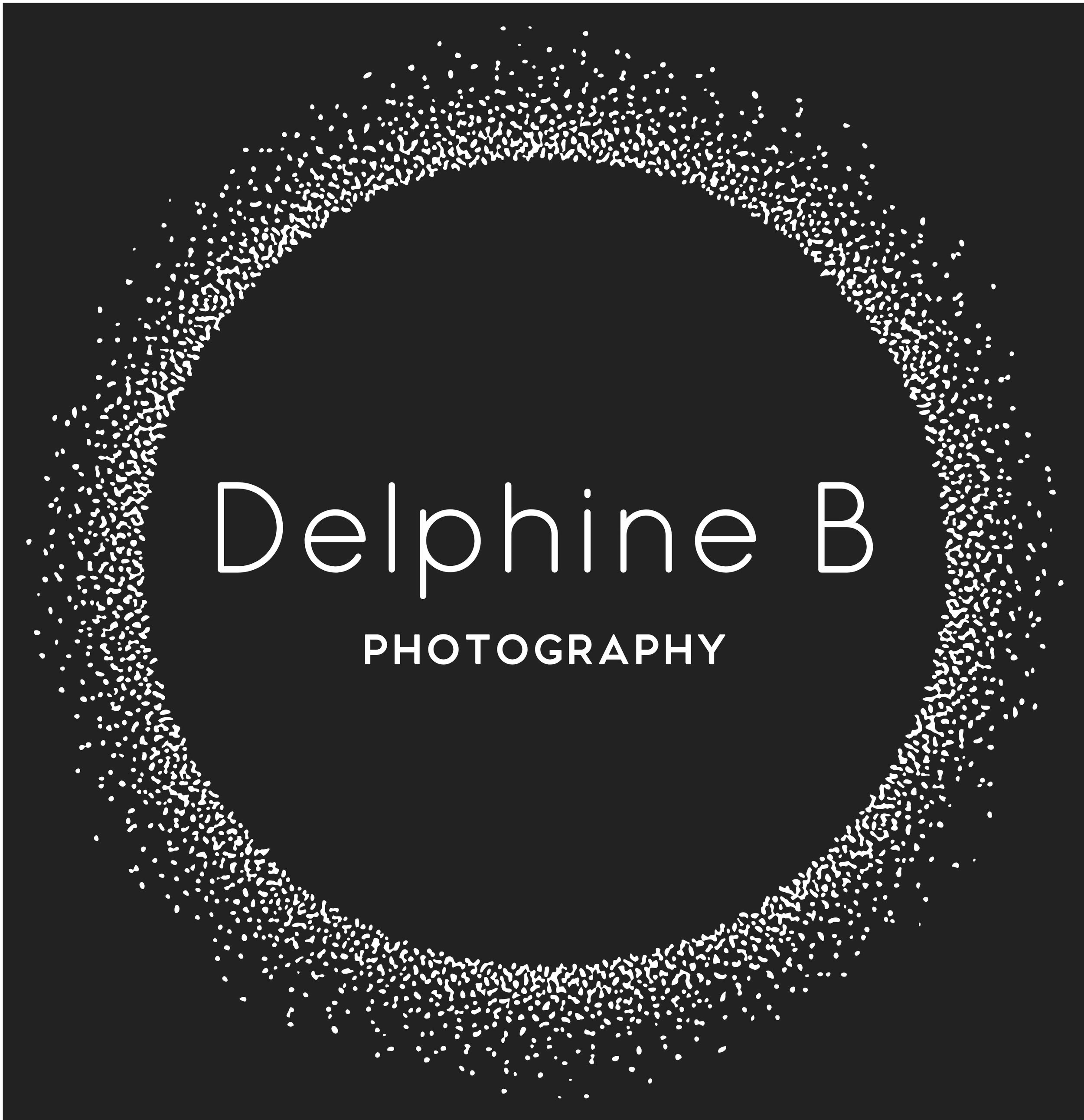 Business card for Delphine B Photography with a black background and a white dotted circular border surrounding the name and profession.