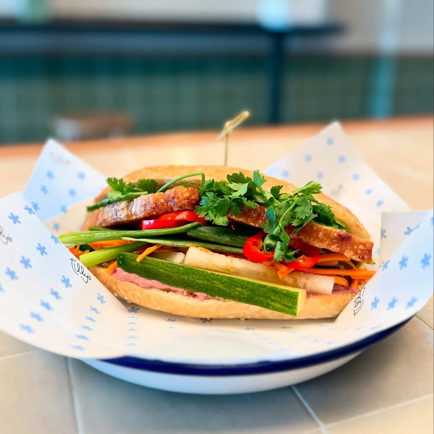 Now on special: our Charcoal Roasted Pork Belly Banh Mi. Served on a Red Bicycle hoagie with pickled veg, fresh herbs, maggi seasoning, and optional chicken liver p&acirc;t&eacute;. $19 with a salad of your choice.