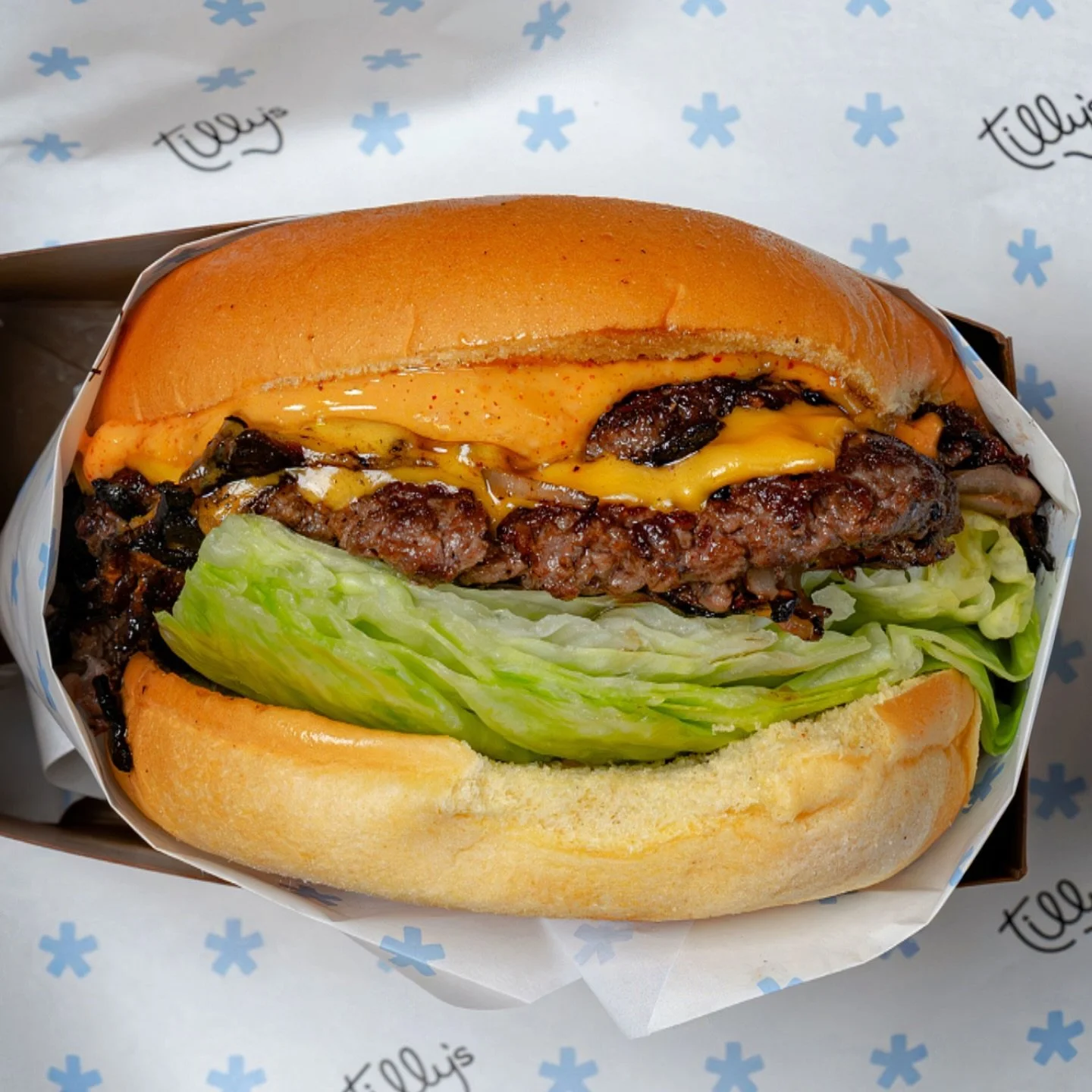 Did a chicken shop just drop the best burger in town? That&rsquo;s for you to decide. Meet the Tilly&rsquo;s Smashburger&mdash;double smashed patties, American cheese, harissa mayo, and a Martin&rsquo;s potato bun.