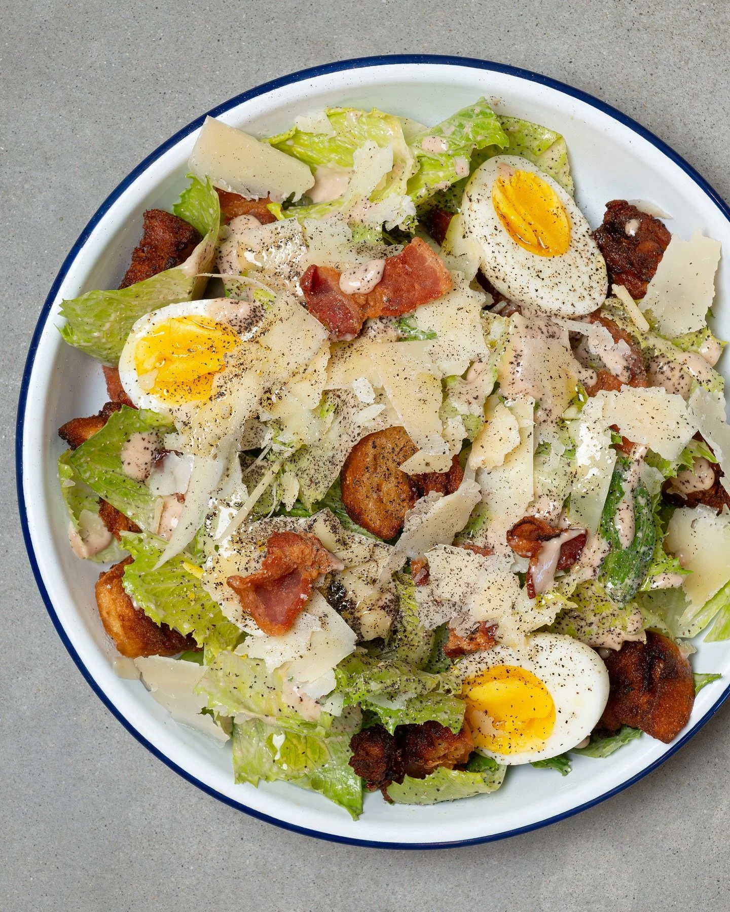 The Caesar salad just got an Aussie upgrade. Meet the Aussie Caesar with bacon, egg, croutons, and Caesar dressing.