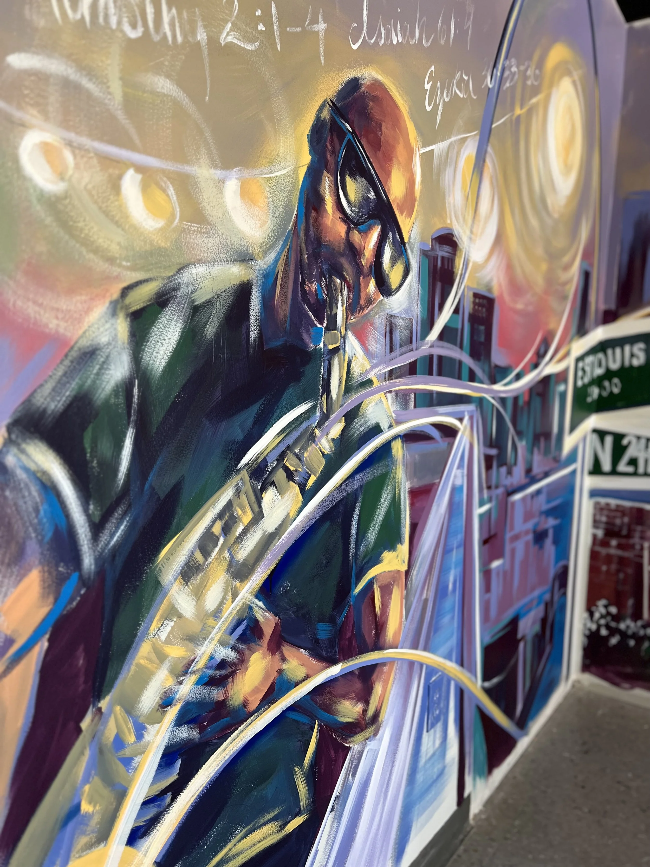 An office mural of a bald man playing the saxophone with swirls of color coming from the instrument