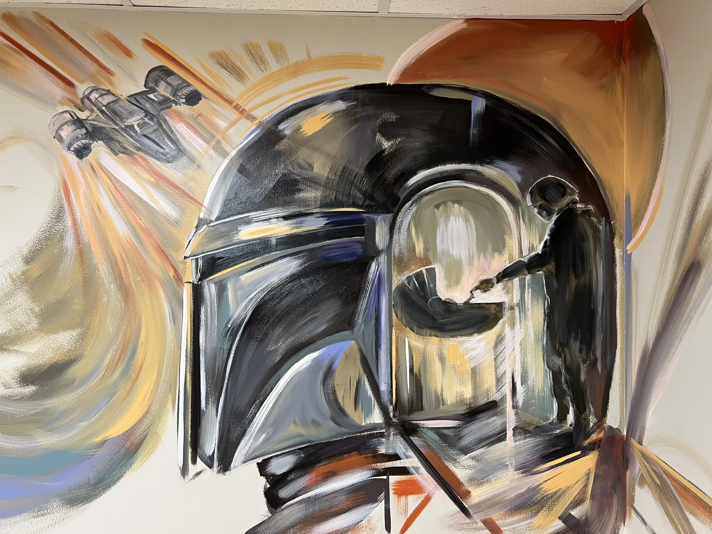Mural in a residential playroom of a side profile of the Mandalorian