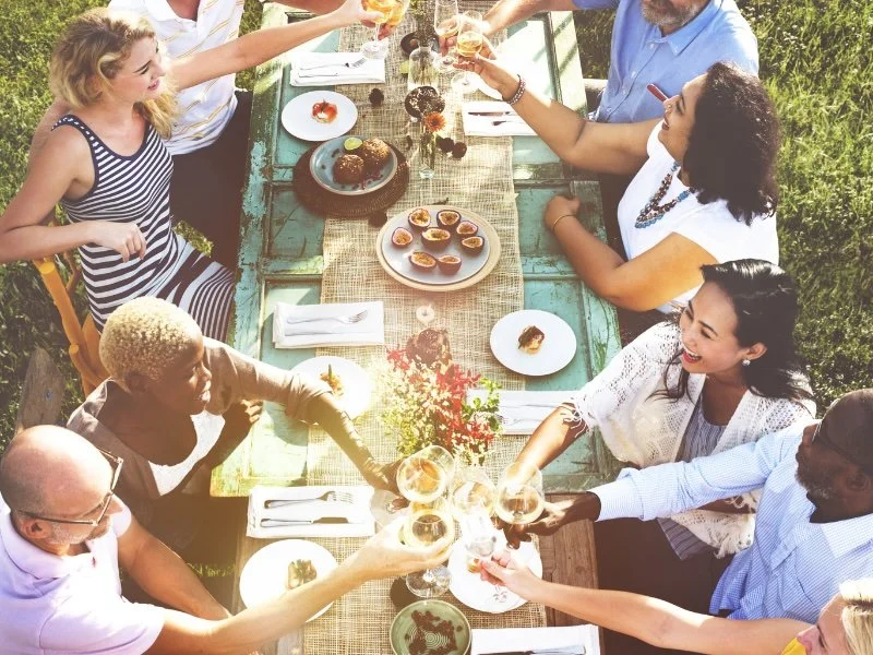 People sitting around a table in a garden