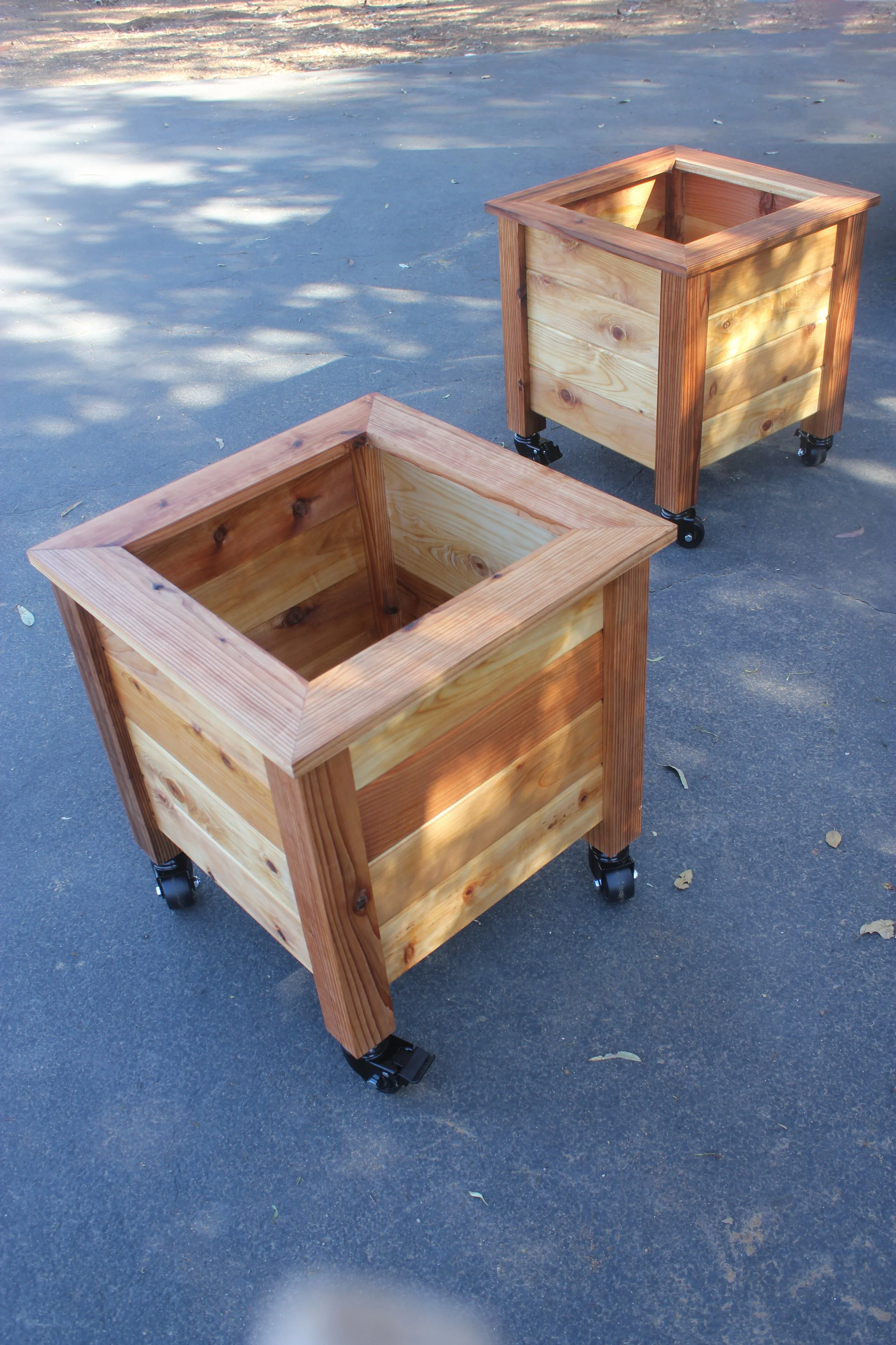 Wooden planter boxes with casters made of natural cedar wood. Ideal for organic gardening, backyard and patio gardening, decorative and culinary plants. Handmade in southern California.