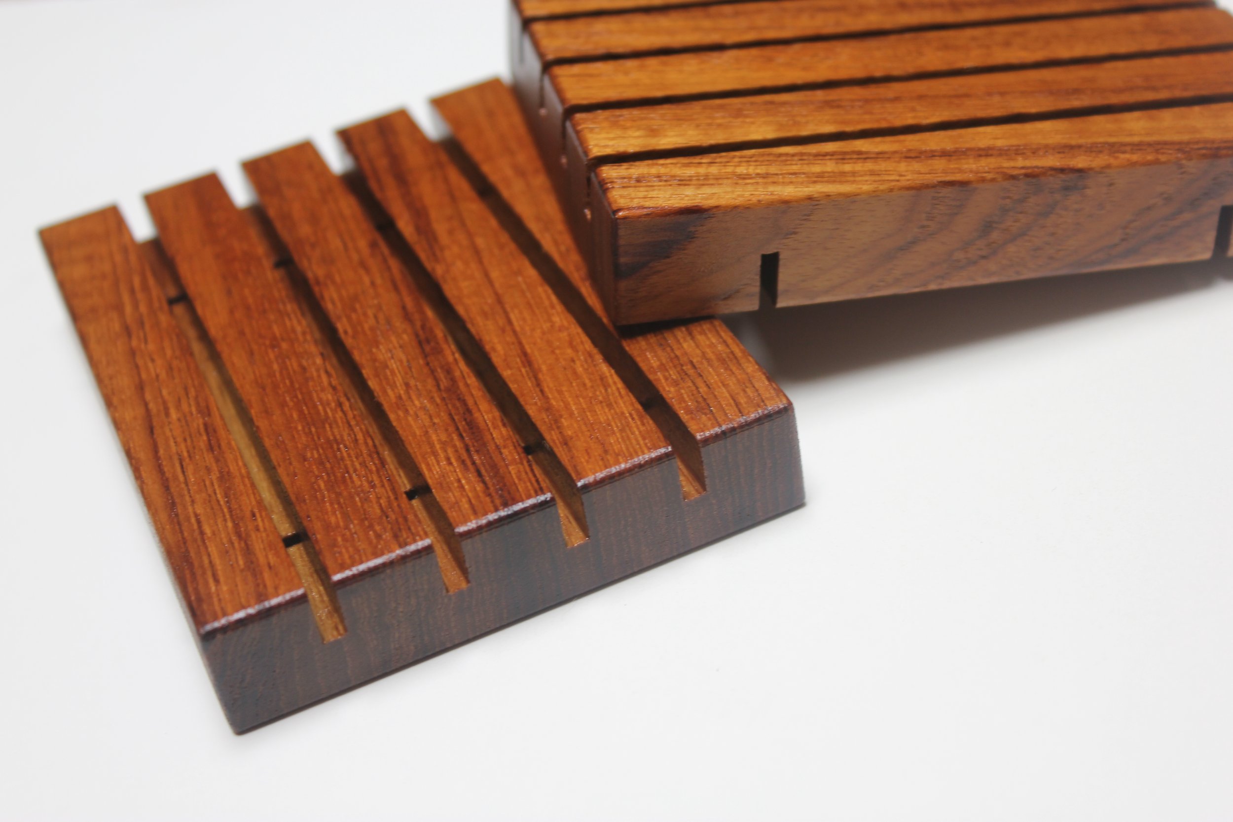 draining style teak wooden soap tray shown in a standard size. Each tray is made of FSC Certified genuine teak wood (tectona grandis) with a 100% natural tung oil finish.