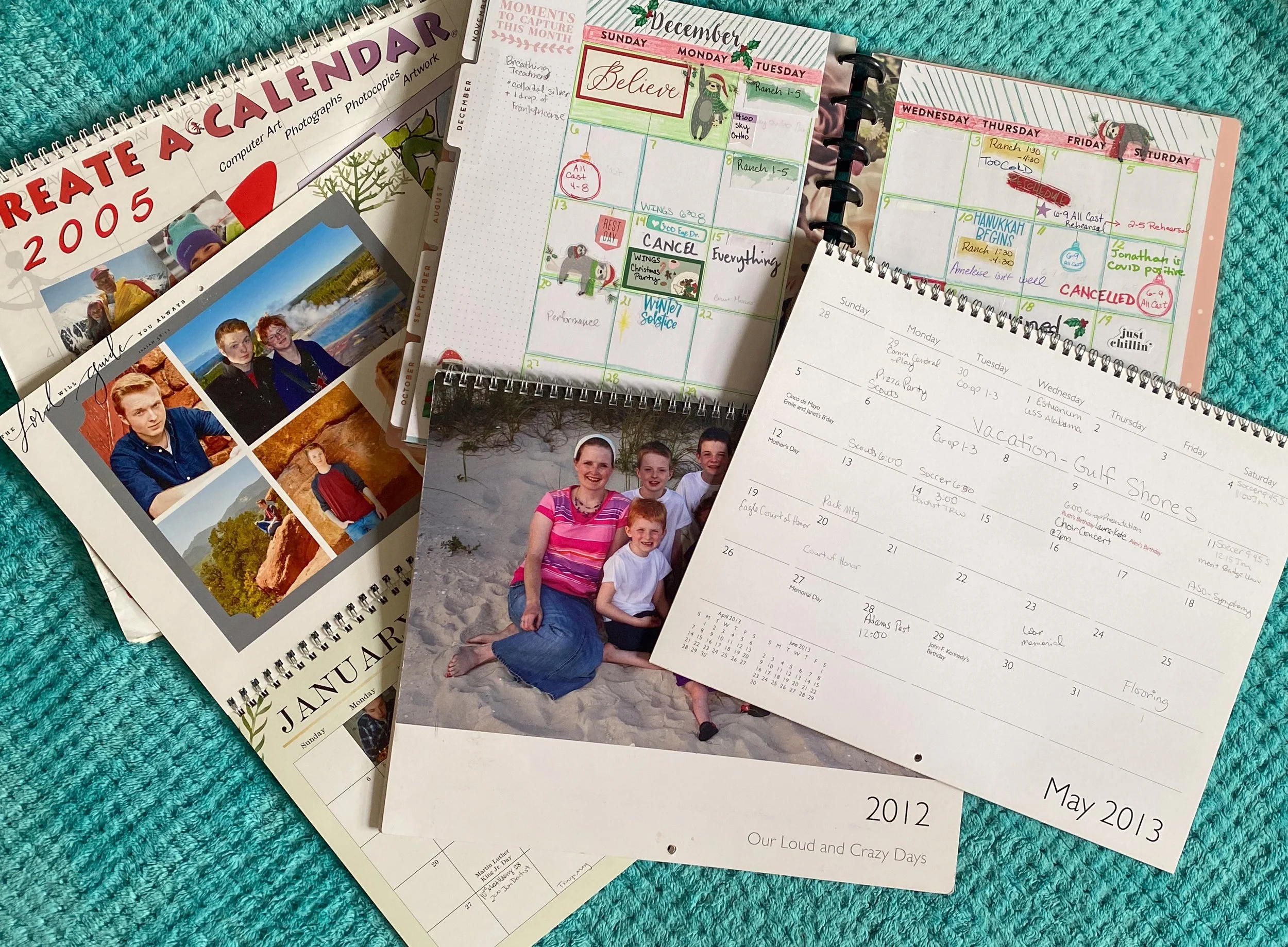 photo calendars from past years showing milestones and memories serve as a family yearbook